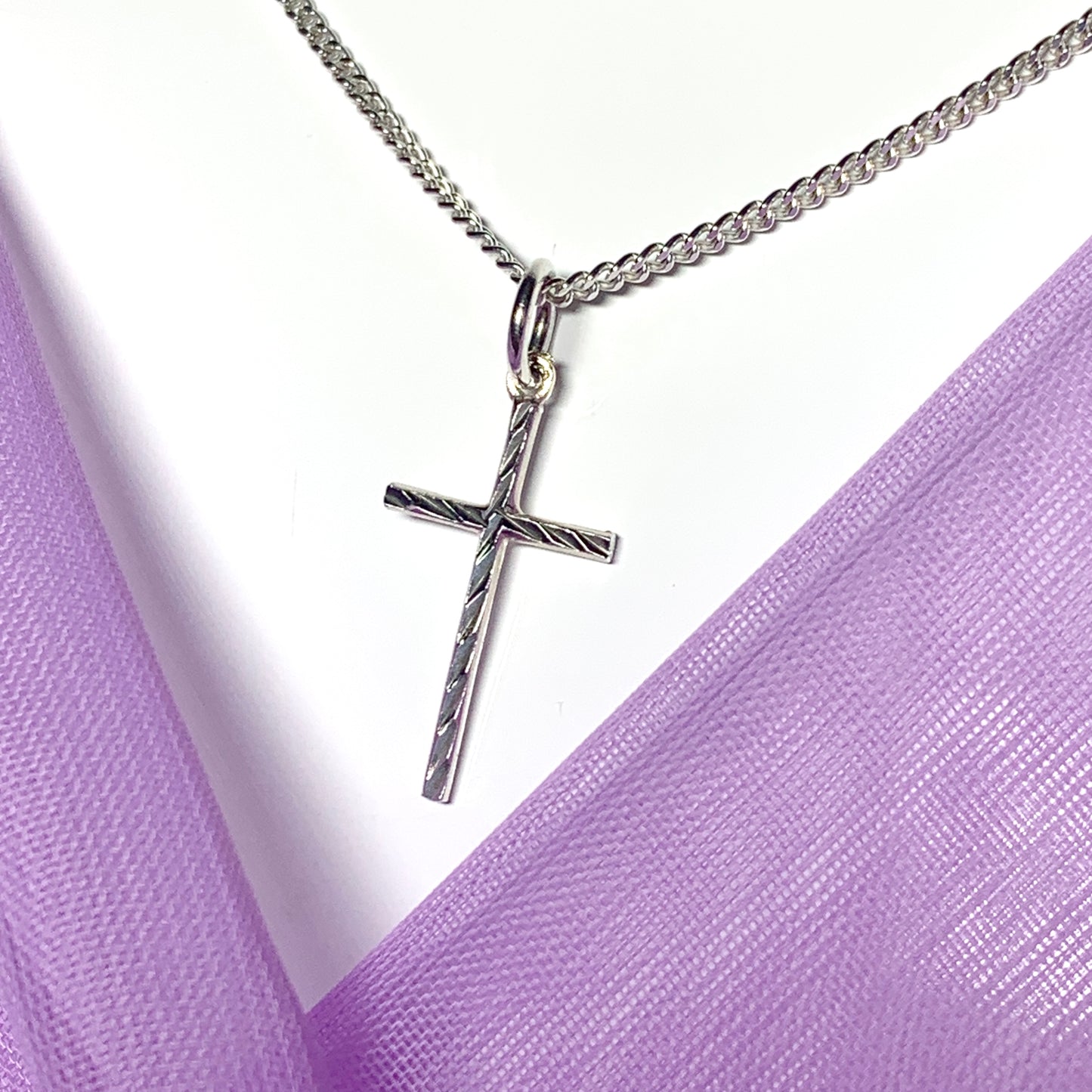 Small solid diamond cut reversible cross patterned sterling silver and chain