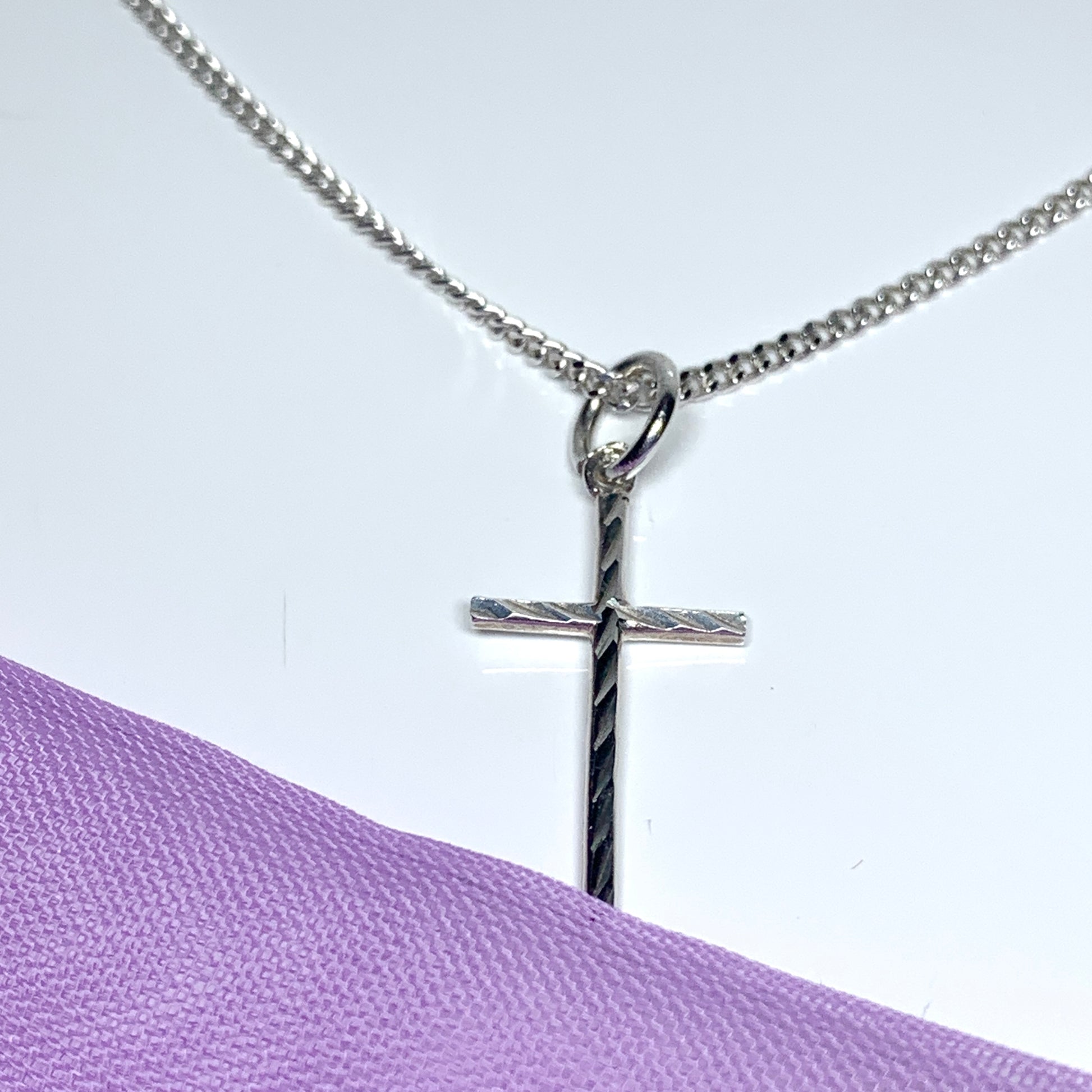 Small solid diamond cut reversible cross patterned sterling silver and chain