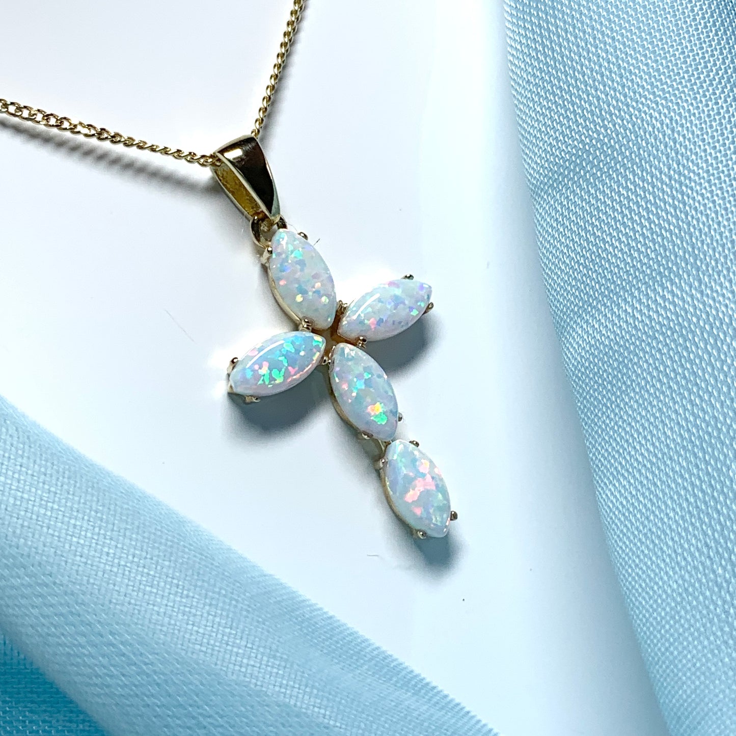 Small yellow gold opal cross necklace including chain