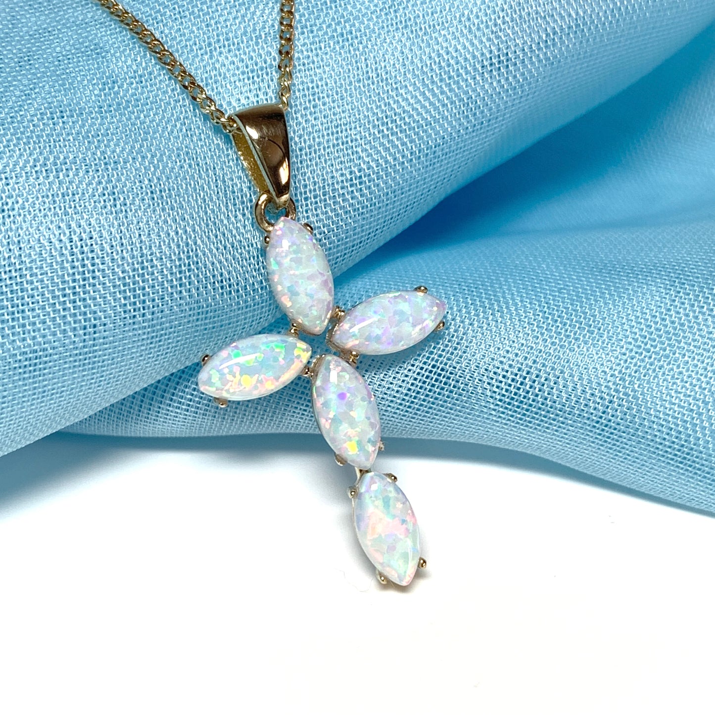 Small yellow gold opal cross necklace including chain