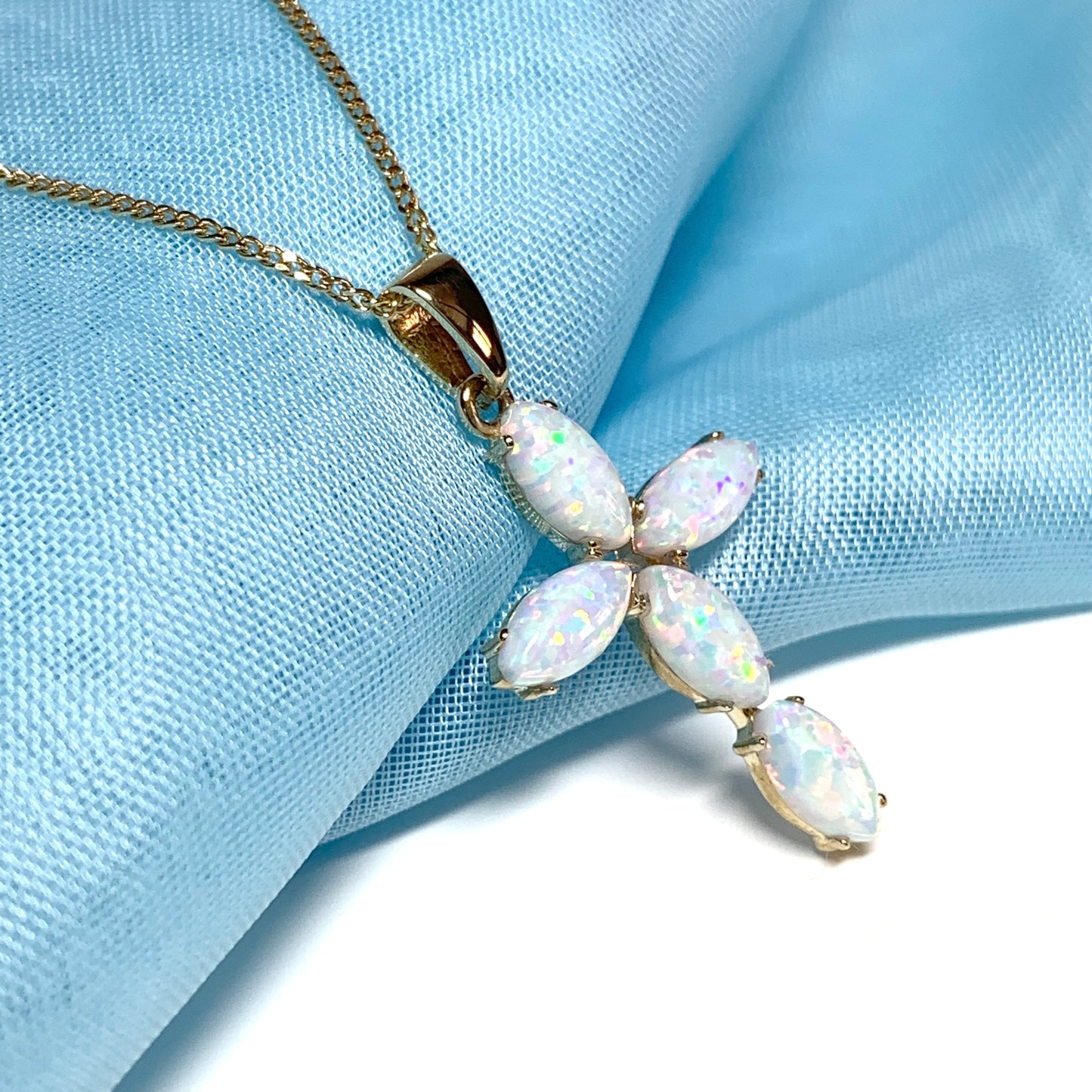 Small yellow gold opal cross necklace including chain