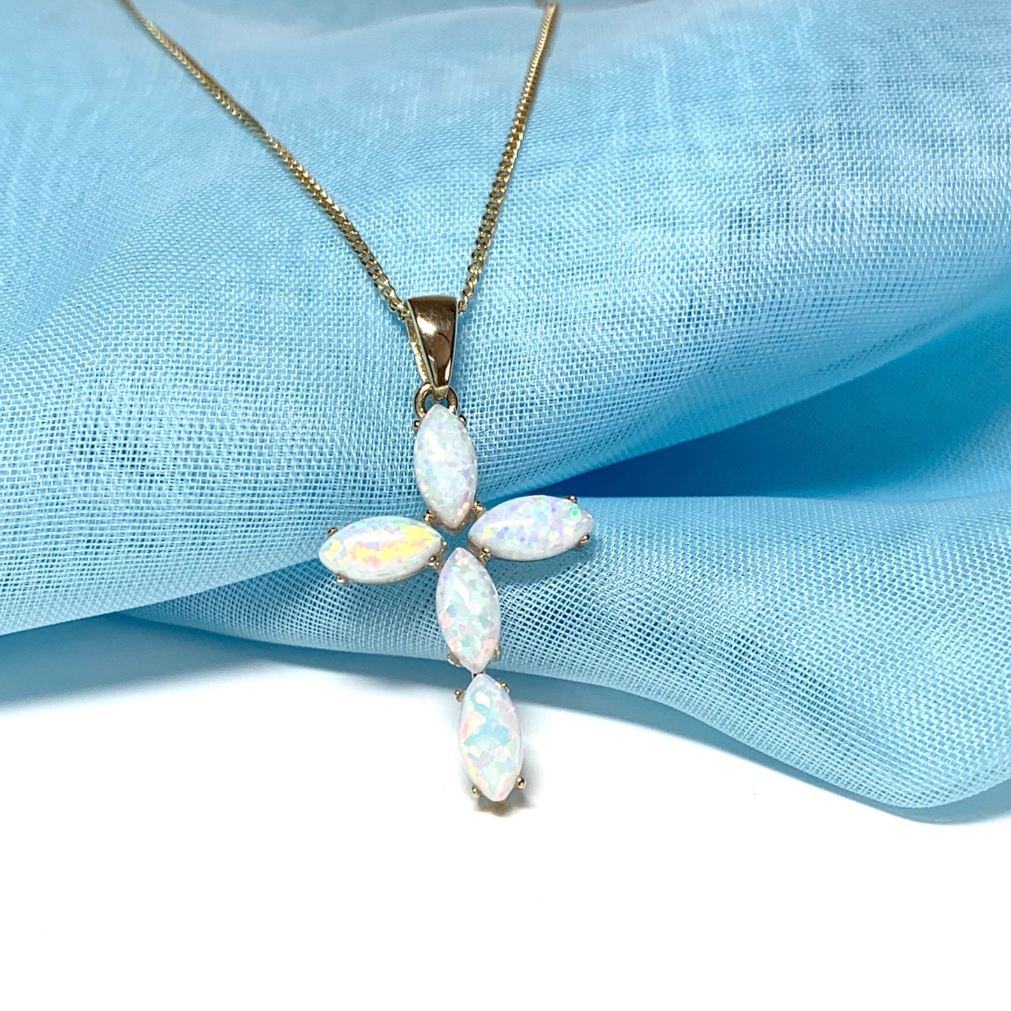 Small yellow gold opal cross necklace including chain