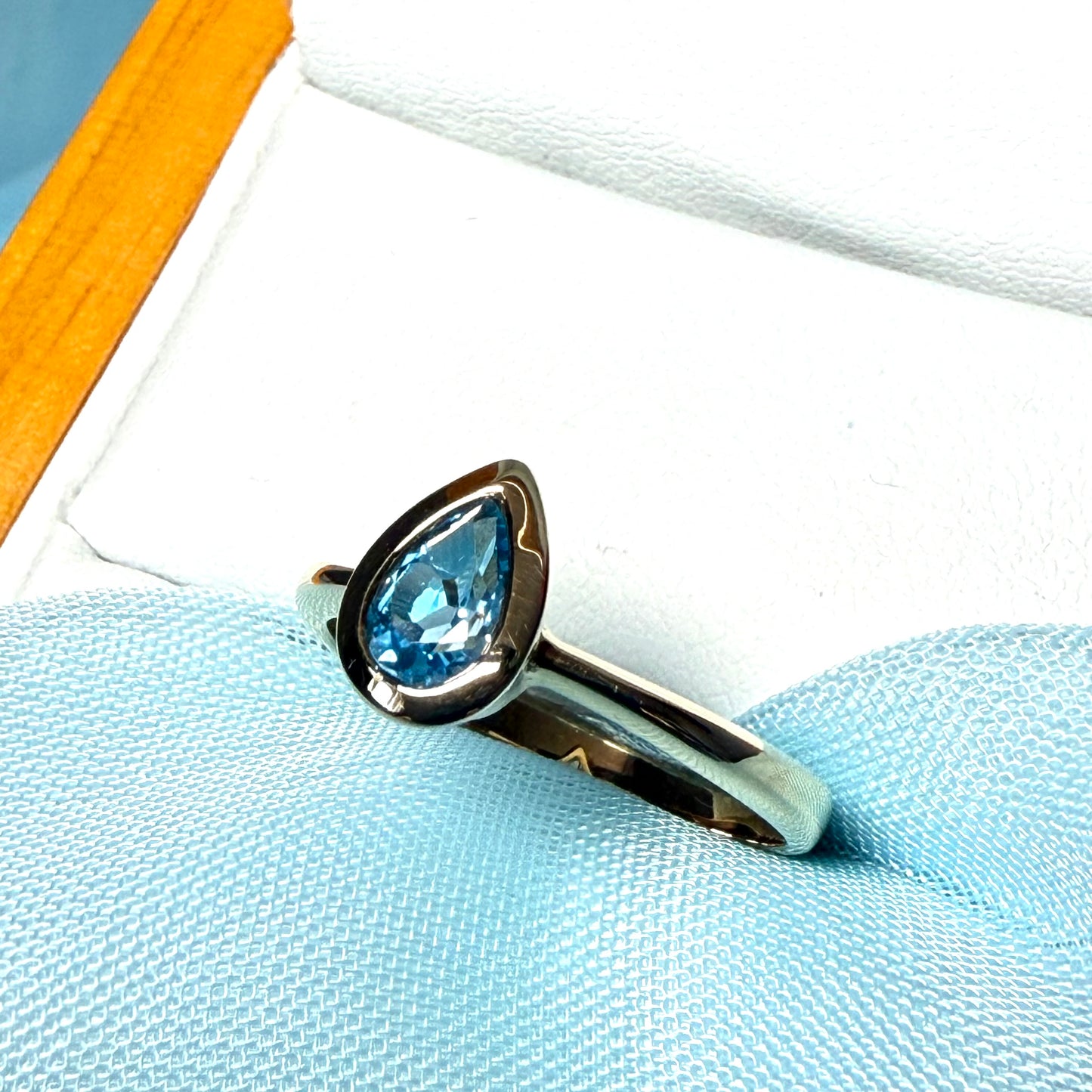 Pear shaped real blue topaz yellow gold dress ring teardrop