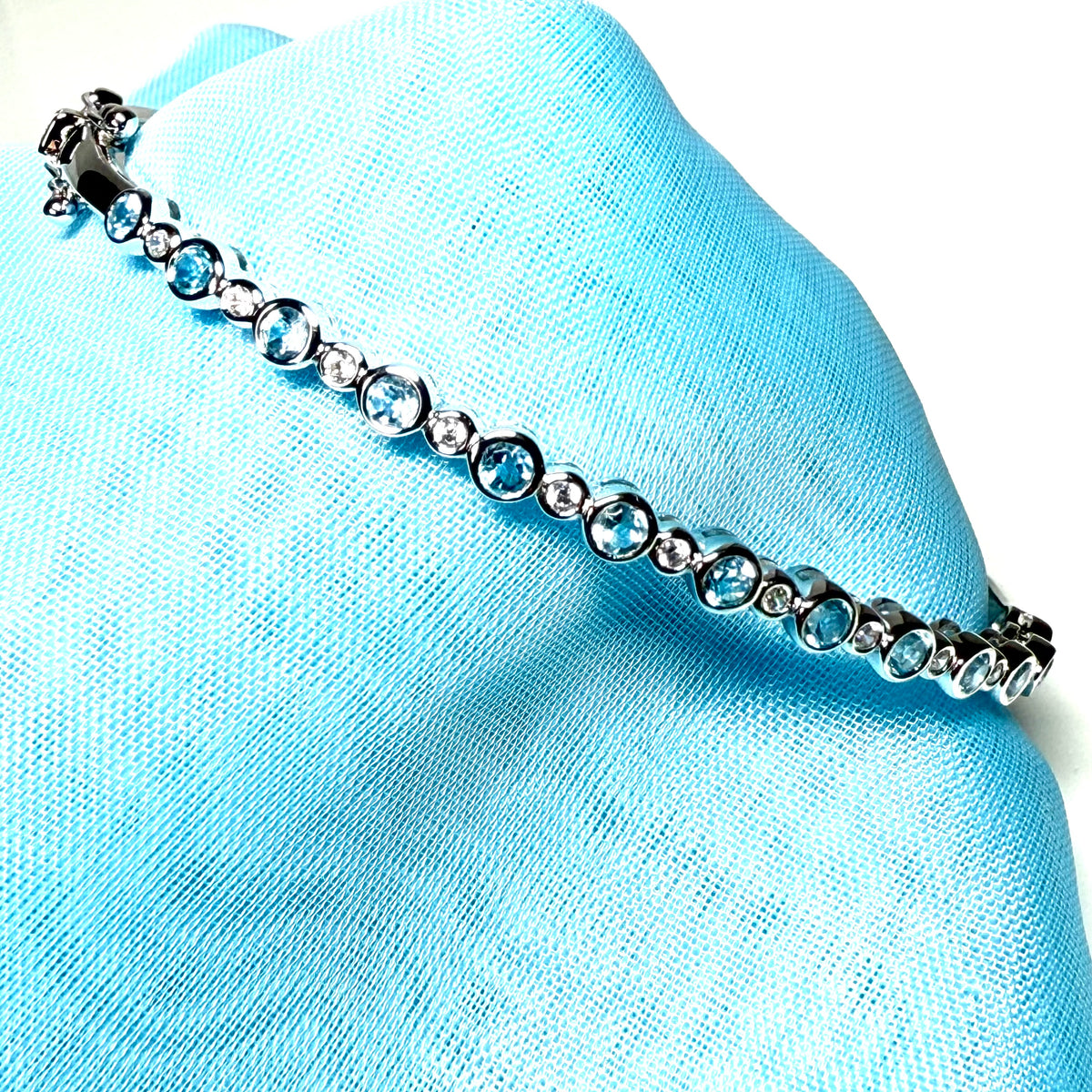 Sterling silver oval shaped real blue topaz cubic zirconia bangle