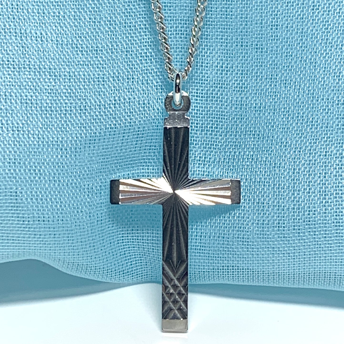 Solid cross patterned sterling silver diamond cut including chain