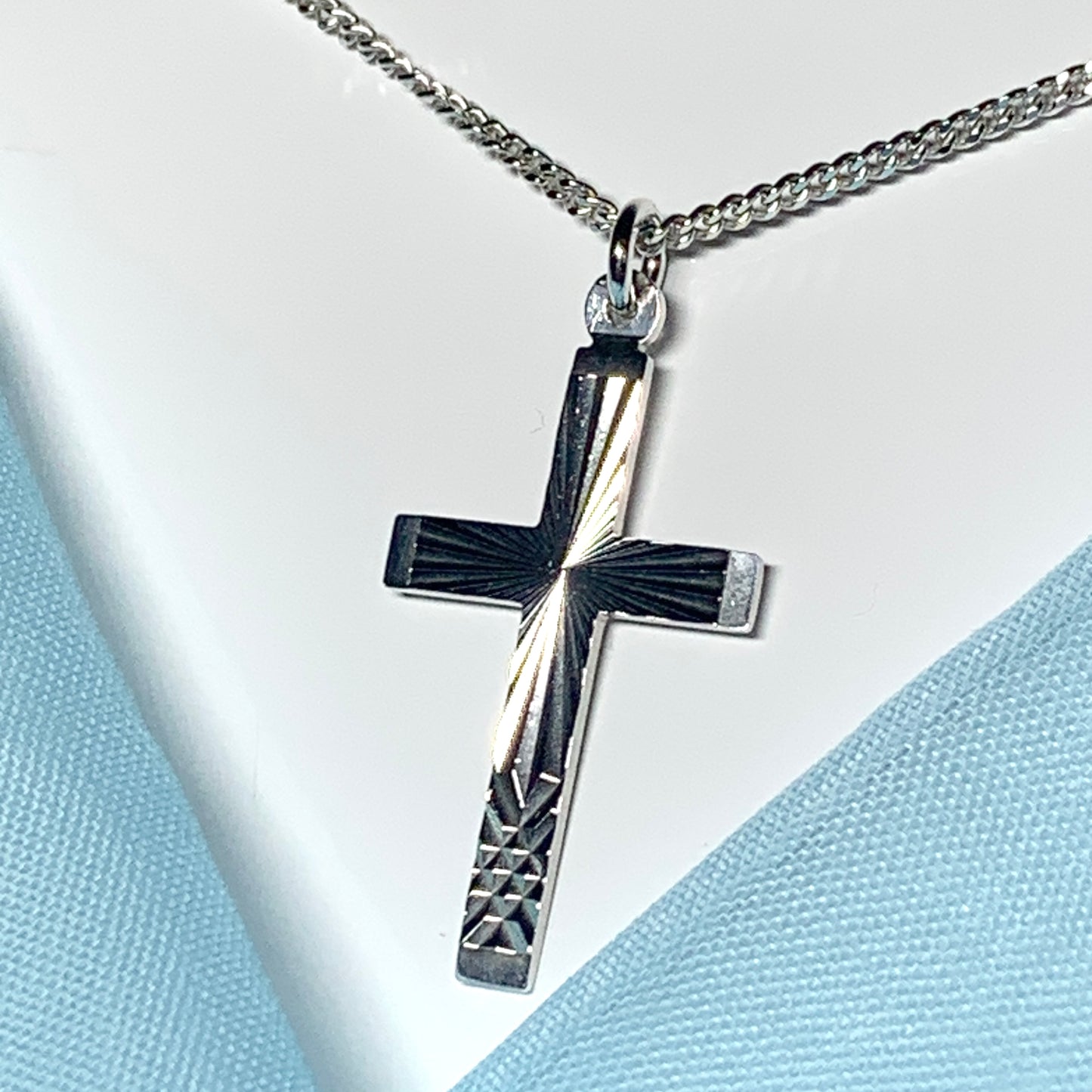 Solid cross patterned sterling silver diamond cut including chain