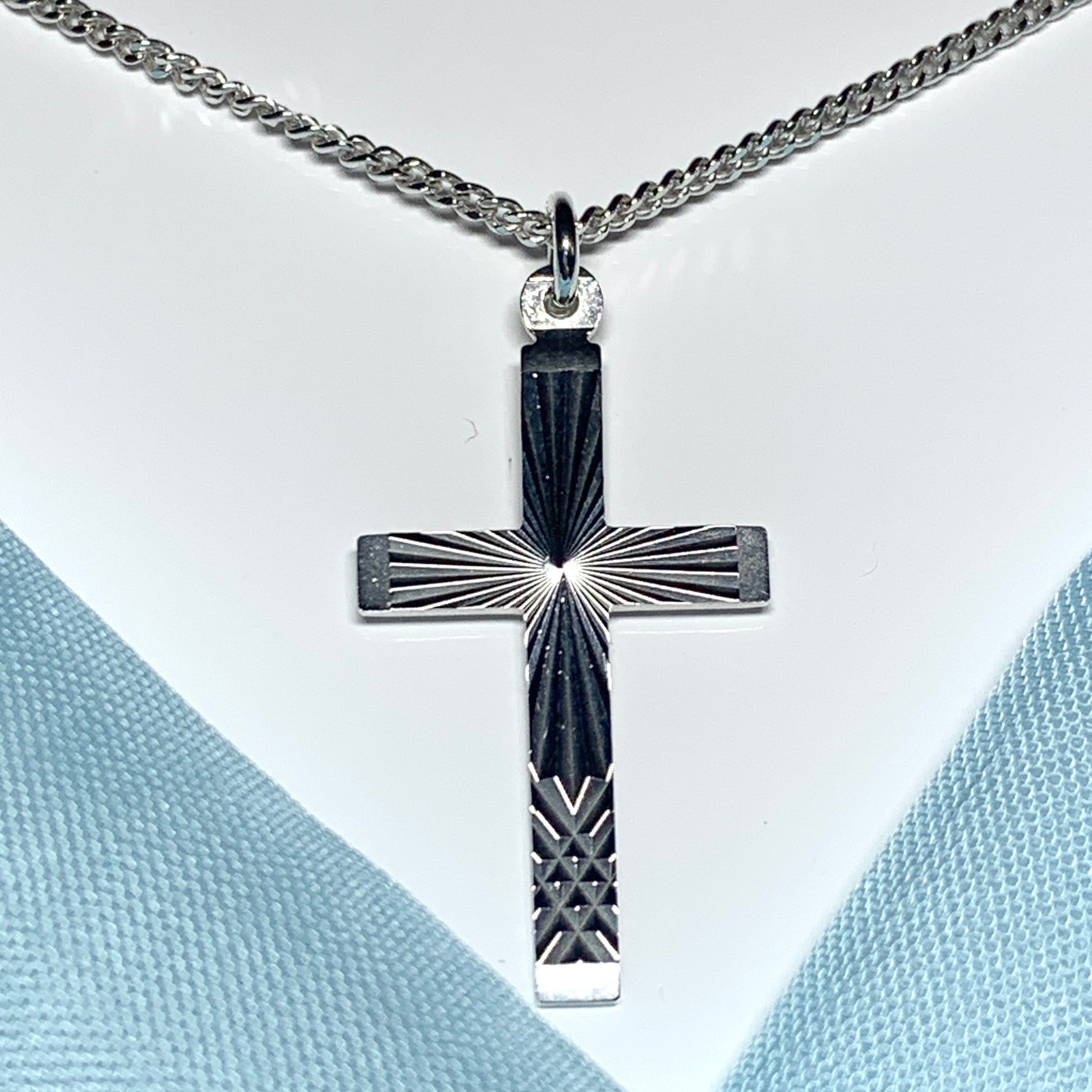 Solid cross patterned sterling silver diamond cut including chain