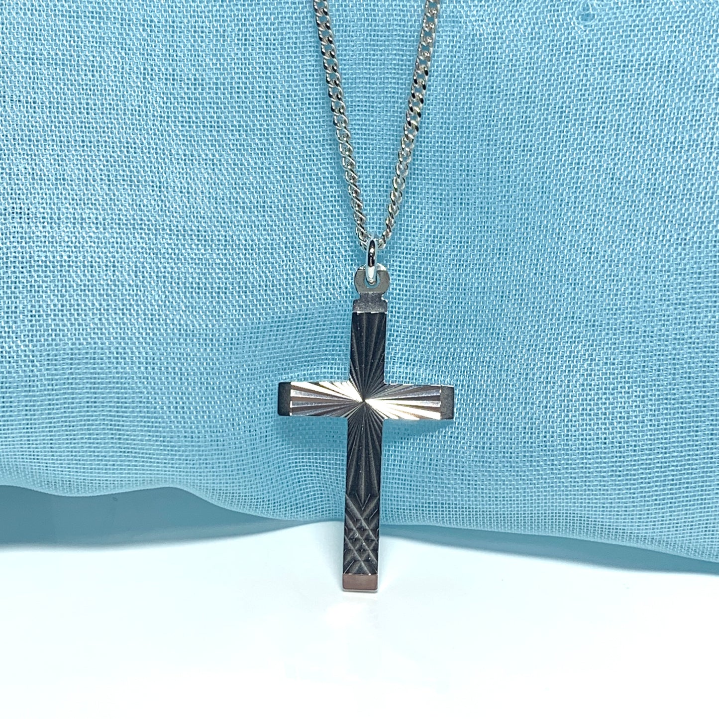 Solid cross patterned sterling silver diamond cut including chain