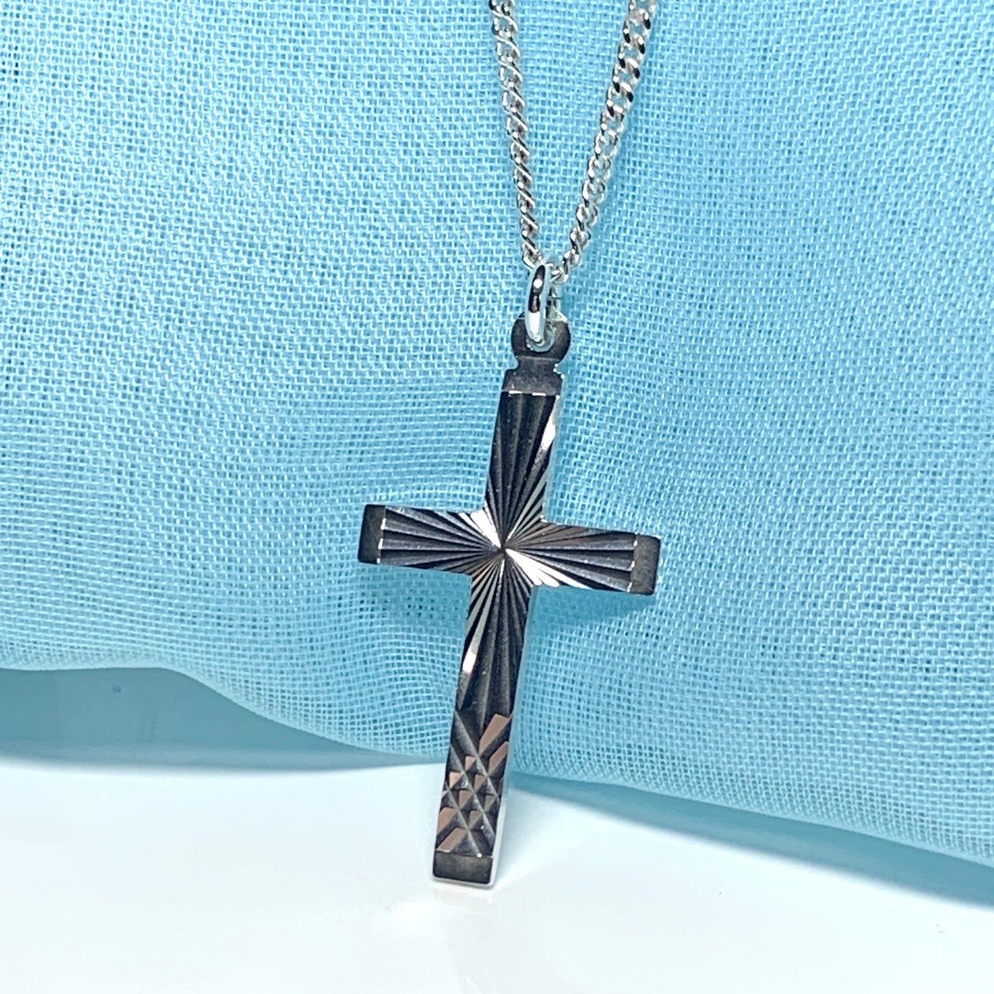 Solid cross patterned sterling silver diamond cut including chain