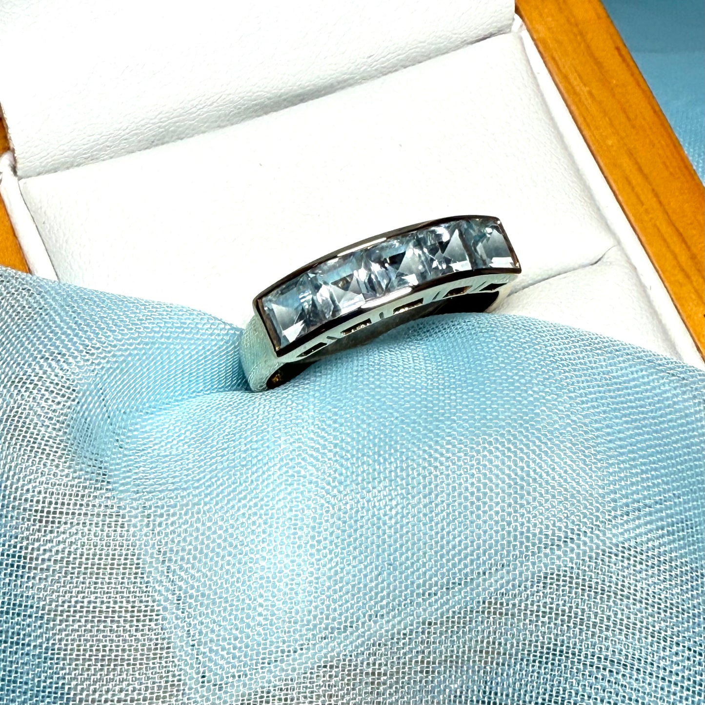 Square shaped real blue topaz yellow gold eternity ring smooth rubbed over invisible setting