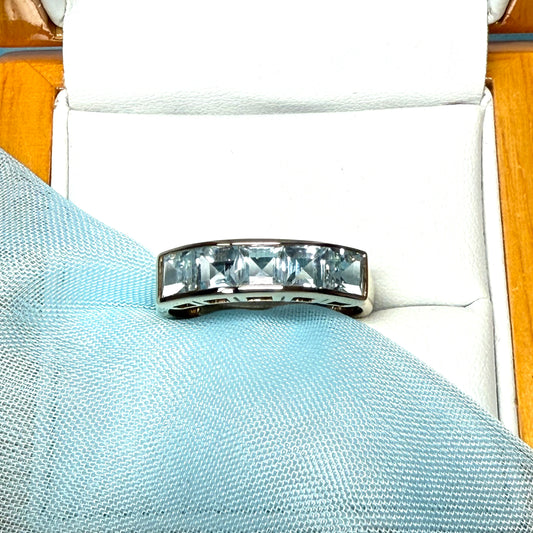 Square shaped real blue topaz yellow gold eternity ring smooth rubbed over invisible setting