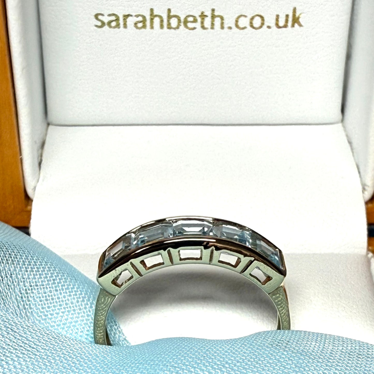 Square shaped real blue topaz yellow gold eternity ring smooth rubbed over invisible setting