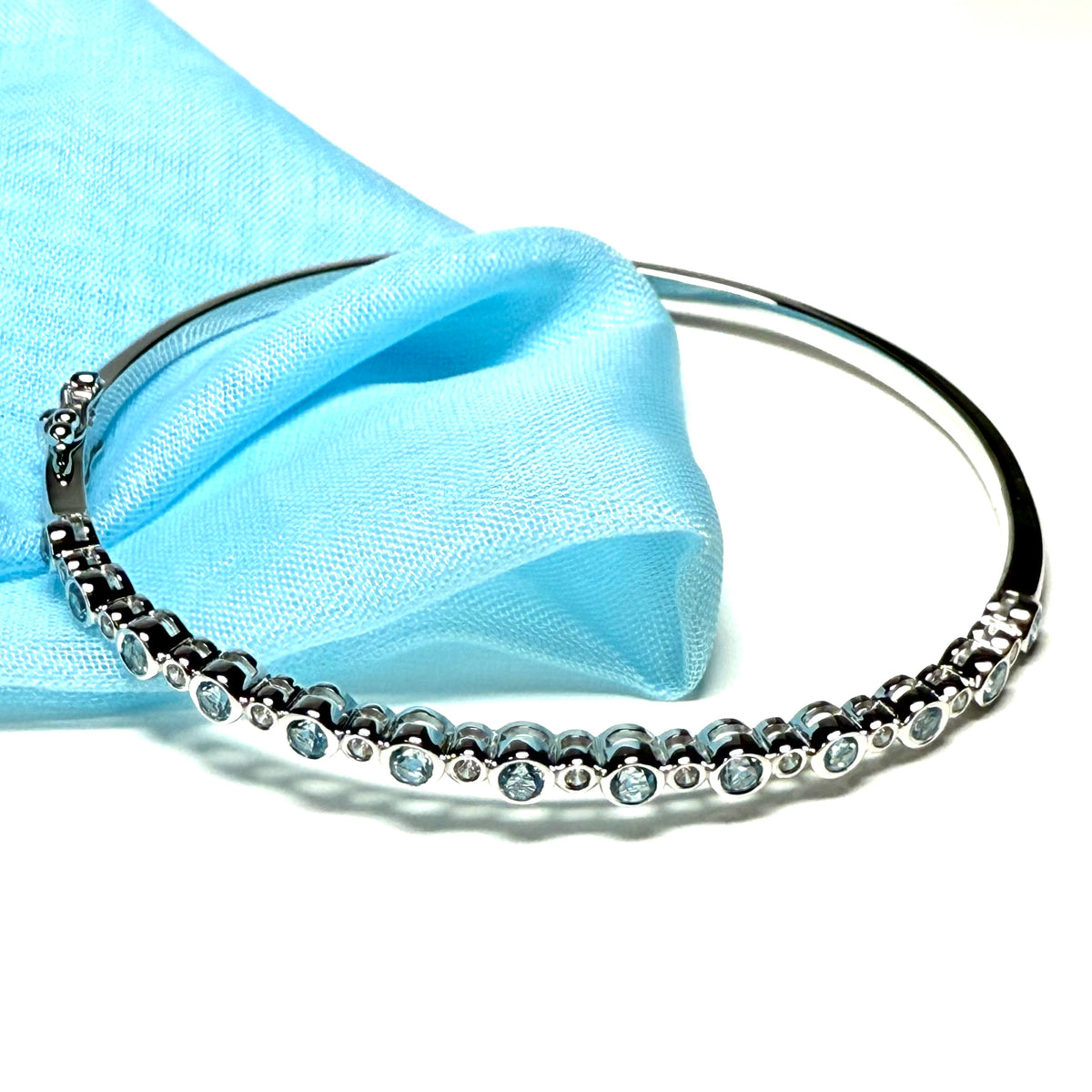 Sterling silver oval shaped real blue topaz cubic zirconia bangle