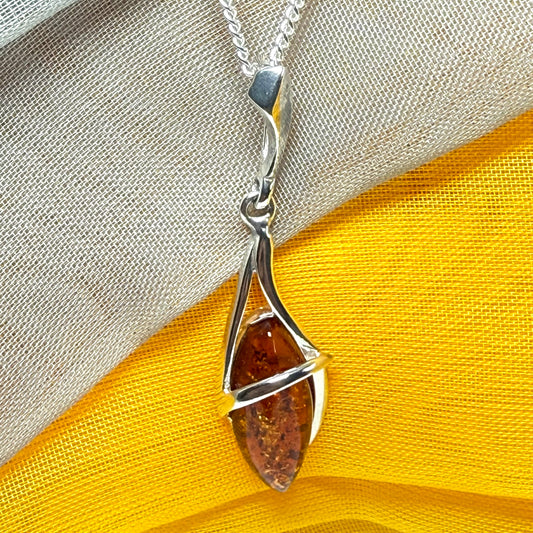 A Sterling silver real amber marquise shaped necklace swirled open pendant with chain