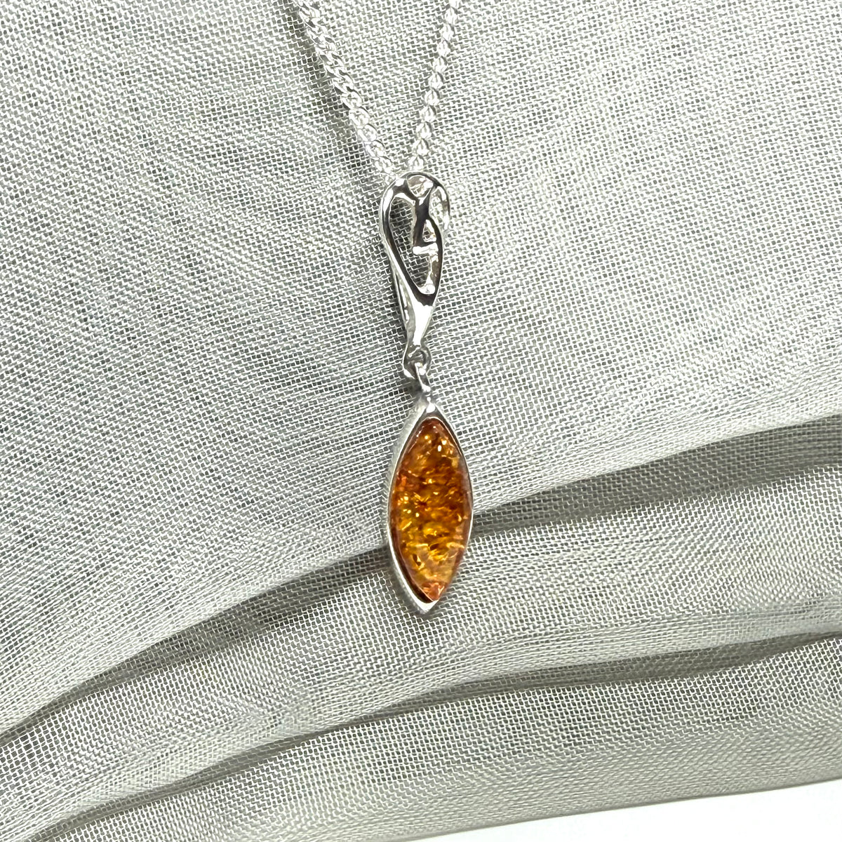 Sterling silver real amber marquise shaped necklace swirled open swirl pendant
