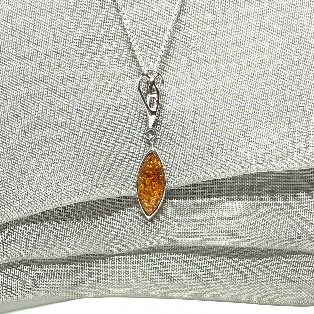 Sterling silver real amber marquise shaped necklace swirled open swirl pendant