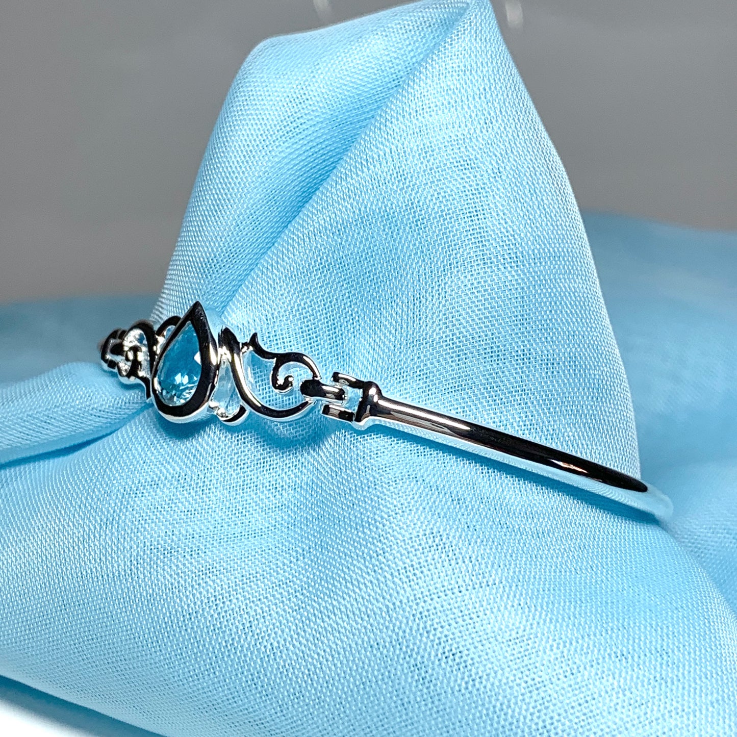 Sterling silver pear shape blue topaz bangle