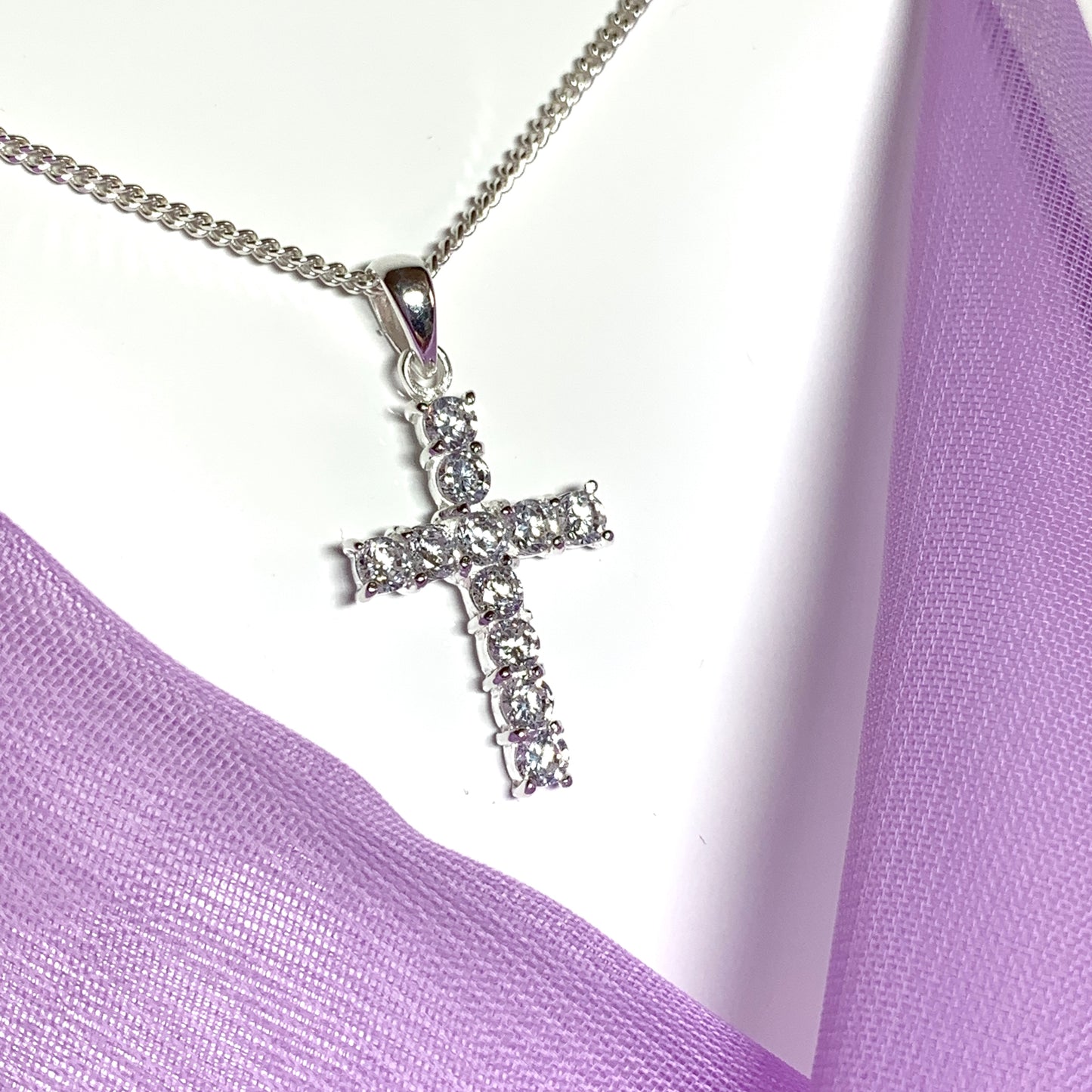 Sterling silver cubic zirconia set cross including chain