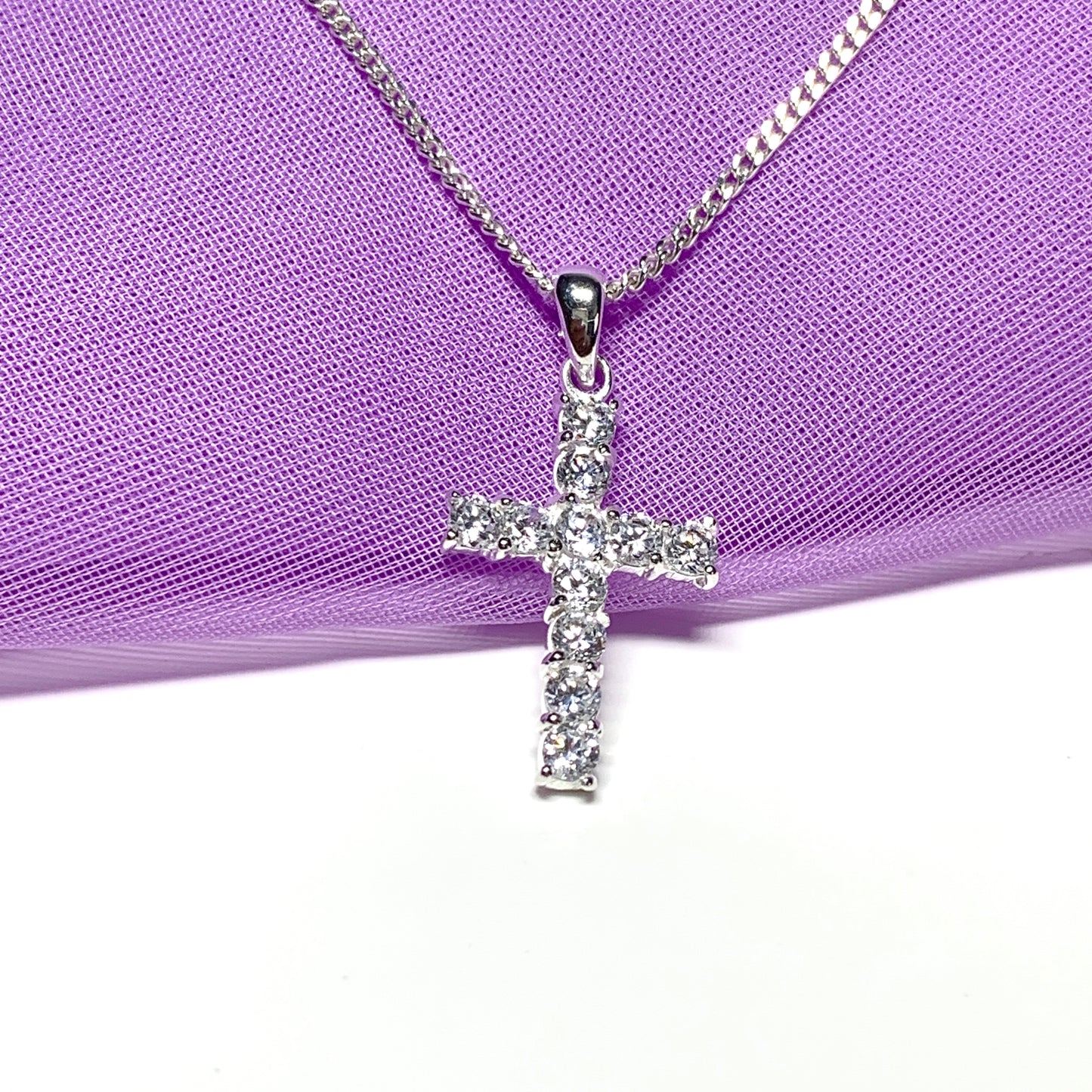 Sterling silver cubic zirconia set cross including chain