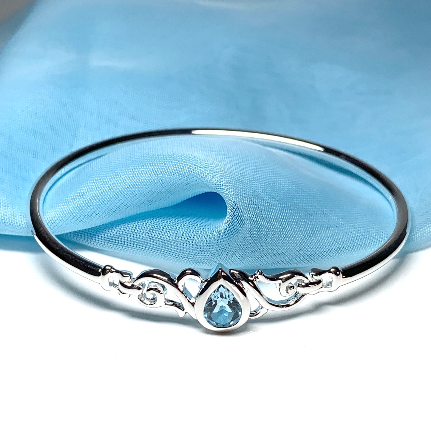 Sterling silver pear shape blue topaz bangle