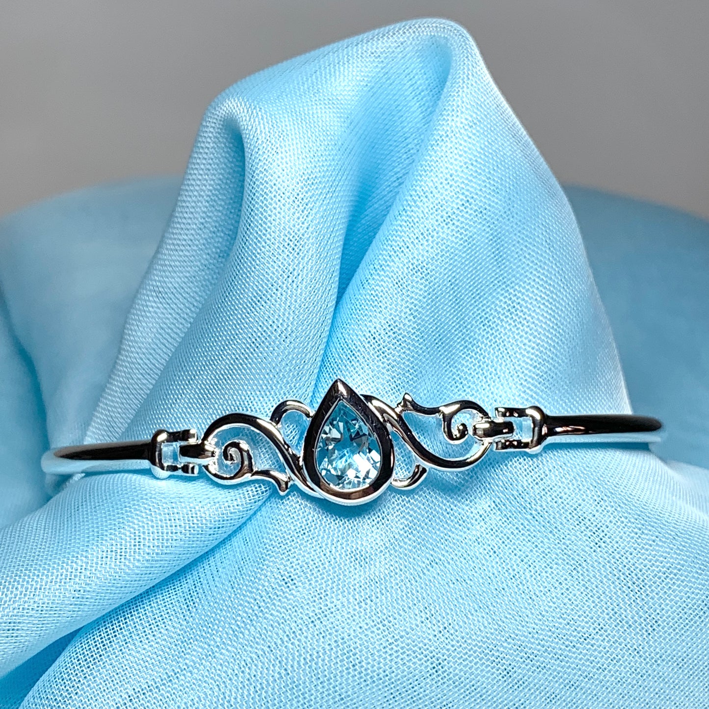 Sterling silver pear shape blue topaz bangle