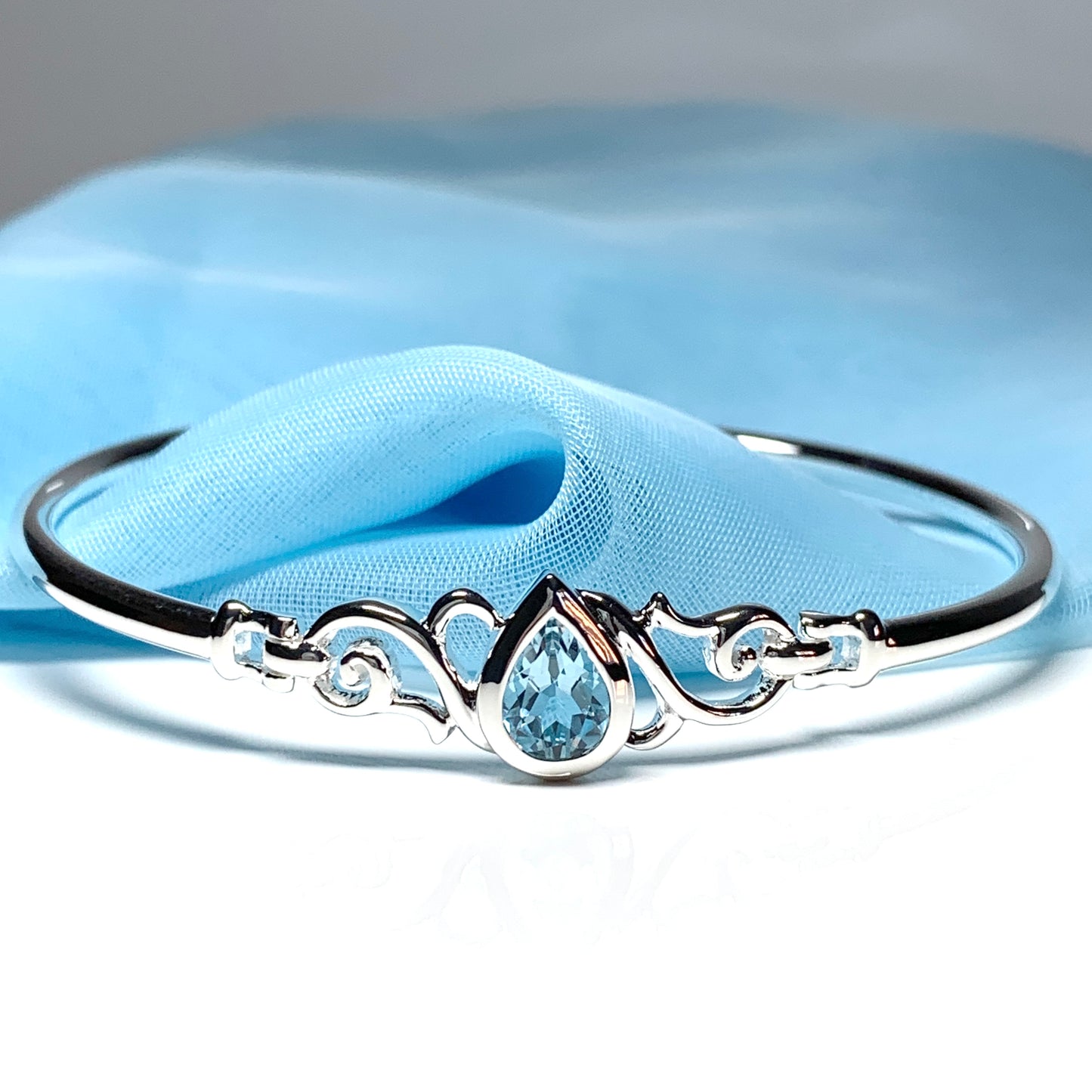 Sterling silver pear shape blue topaz bangle