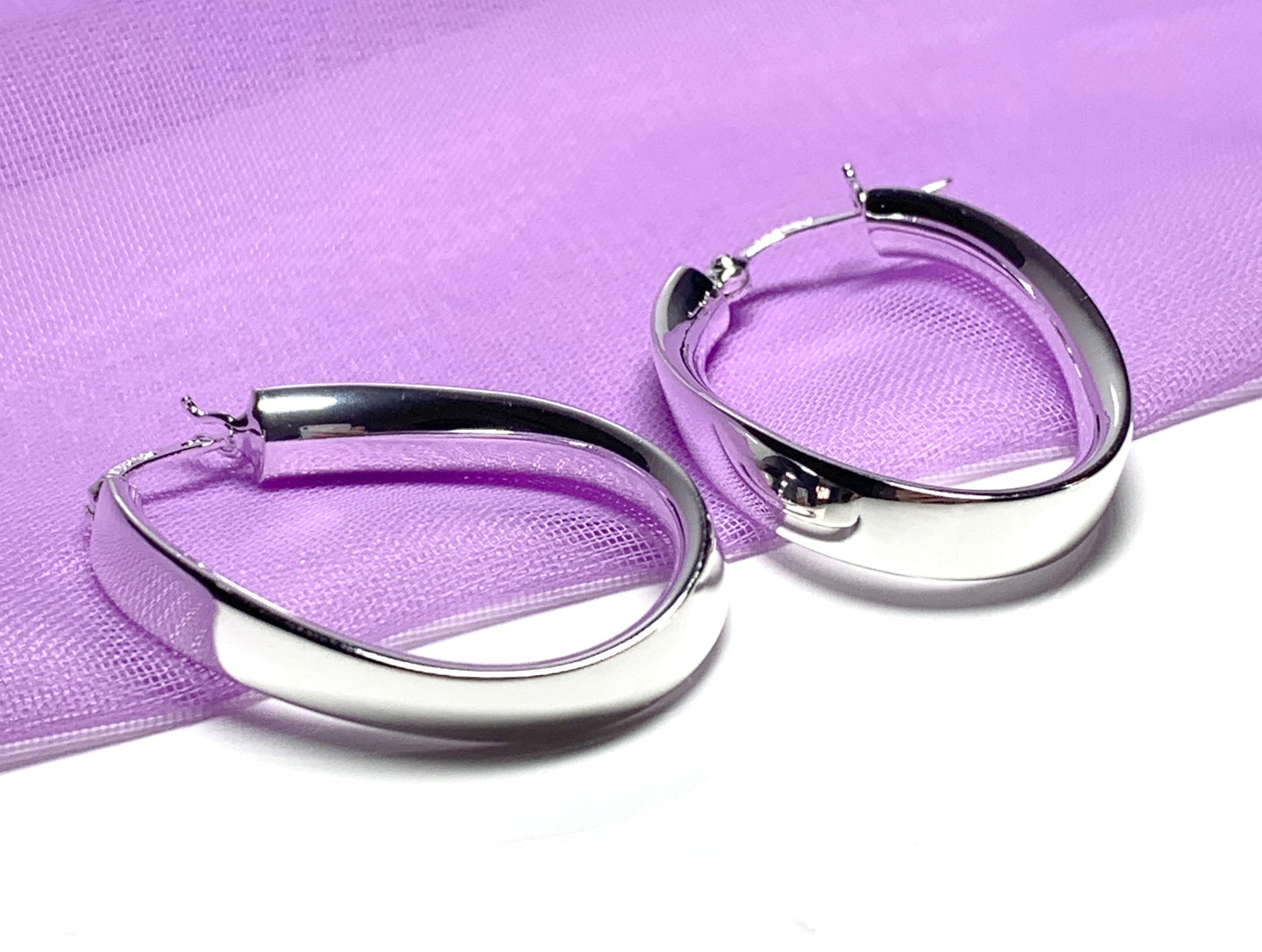 Sterling silver polished oval twisted hoop creole earrings