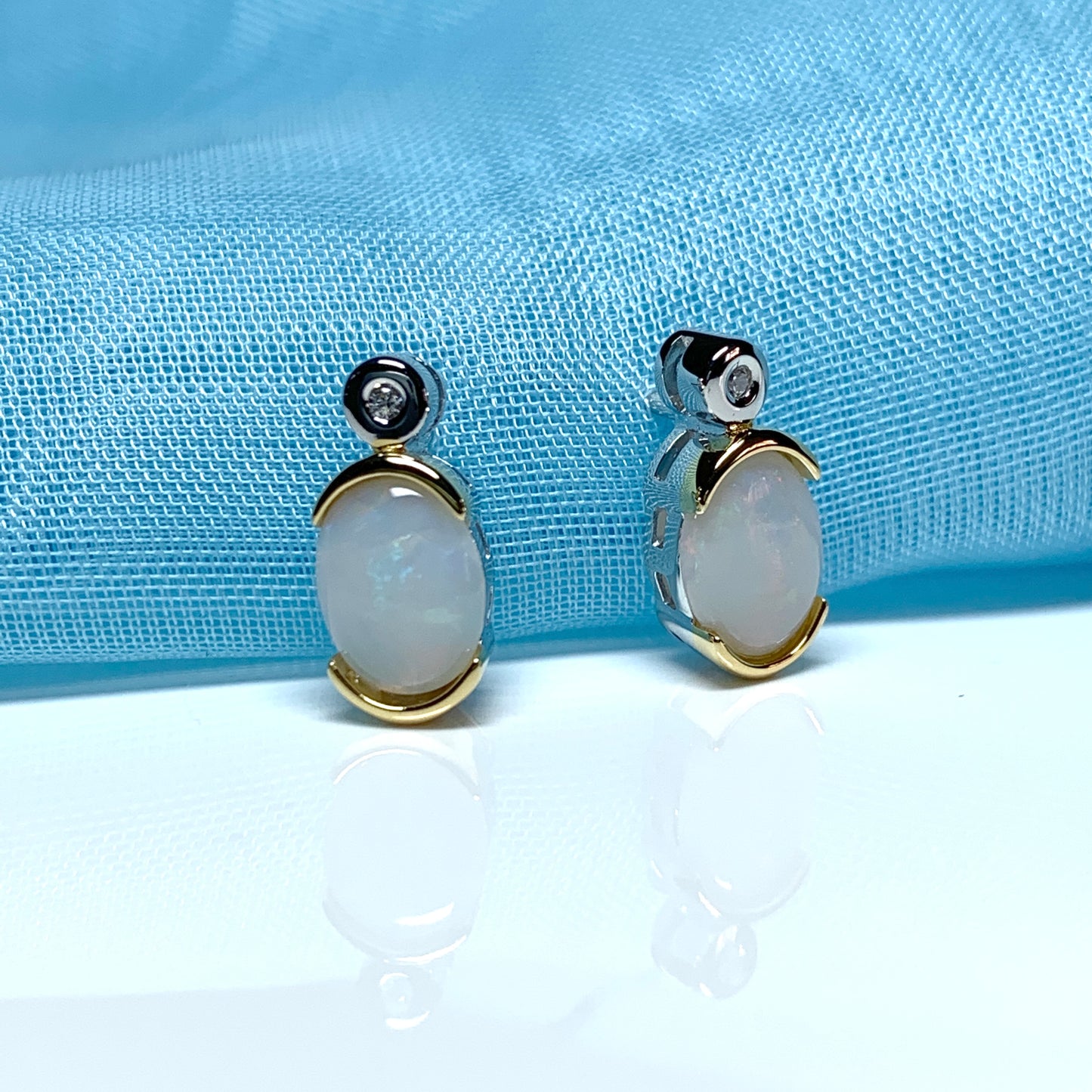 Sterling silver real opal oval and cubic zirconia stud earrings