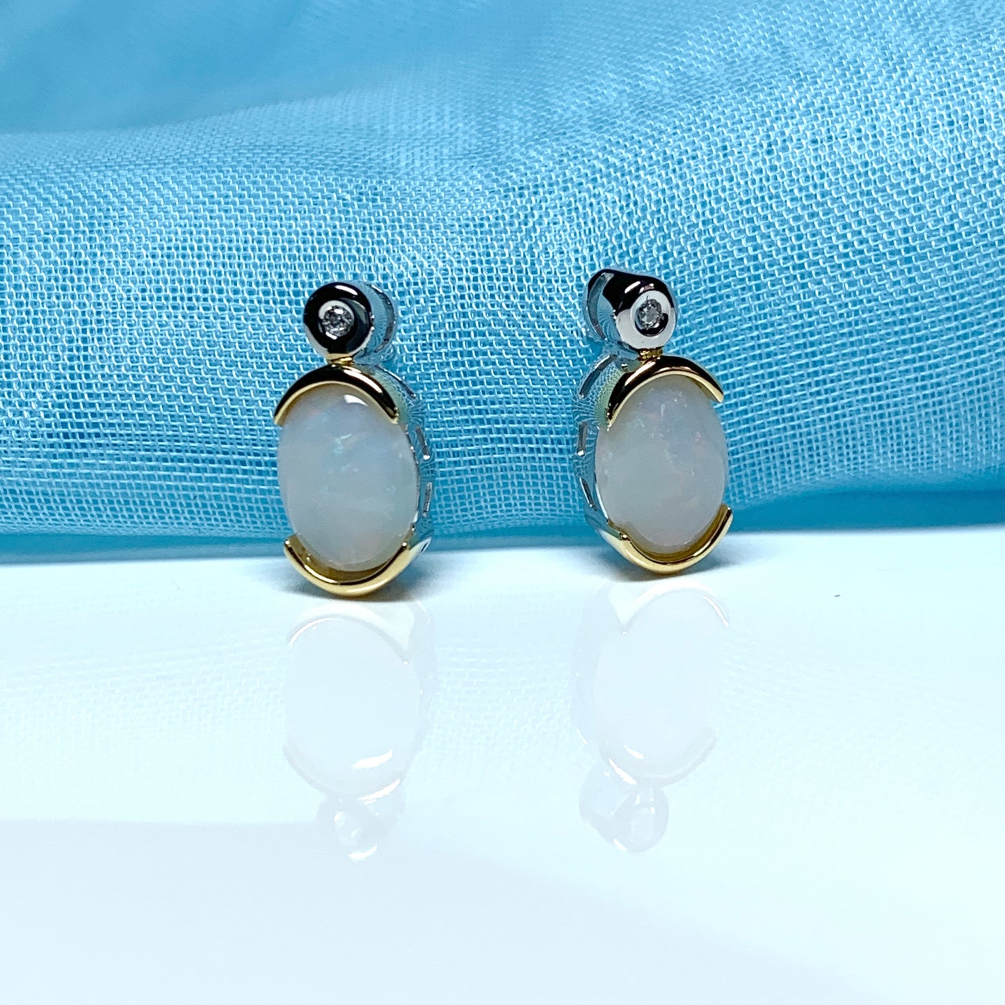 Sterling silver real opal oval and cubic zirconia stud earrings