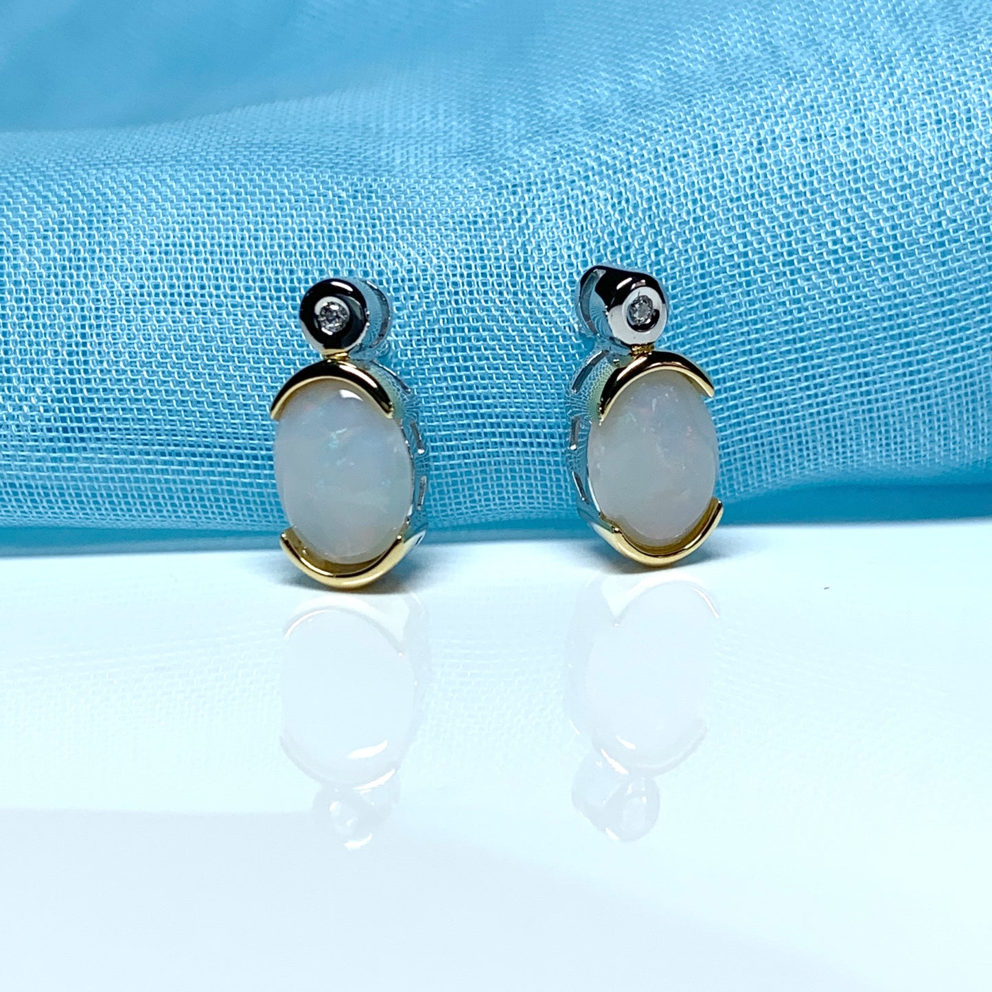 Sterling silver real opal oval and cubic zirconia stud earrings