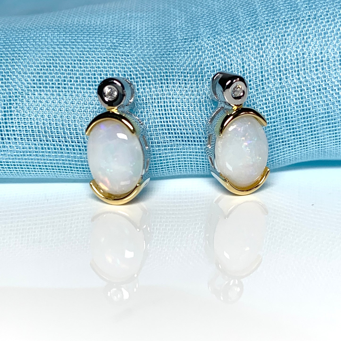 Sterling silver real opal oval and cubic zirconia stud earrings