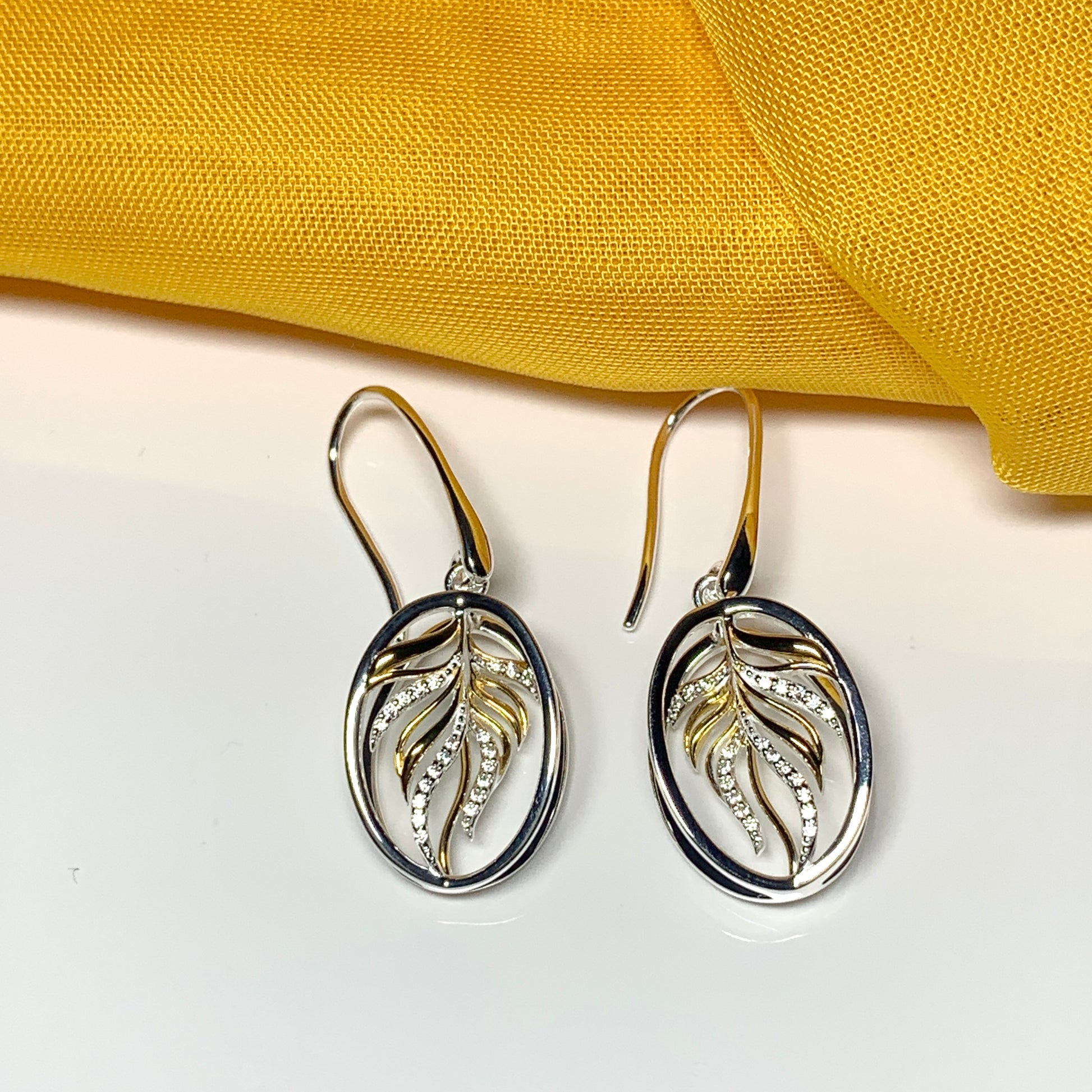 Sterling silver two tone oval drop earrings