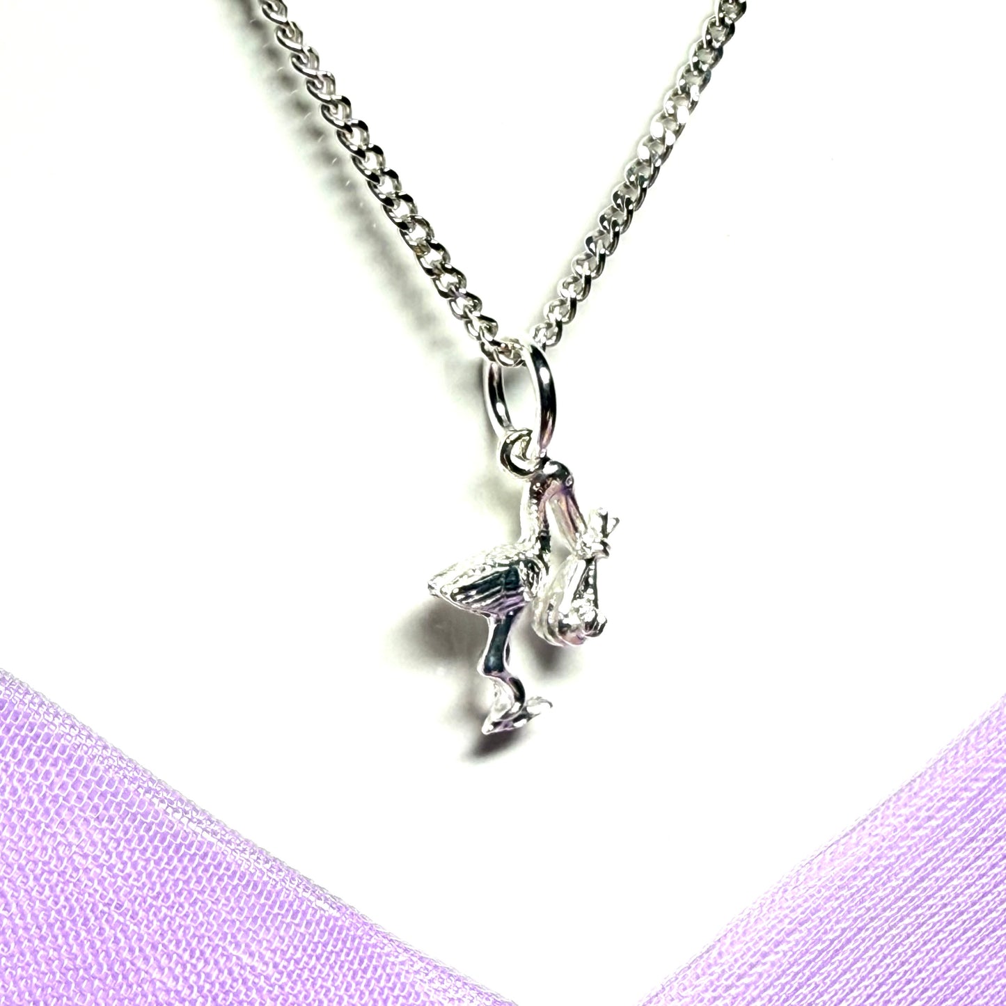 Stork carrying a baby necklace sterling silver charm pendant