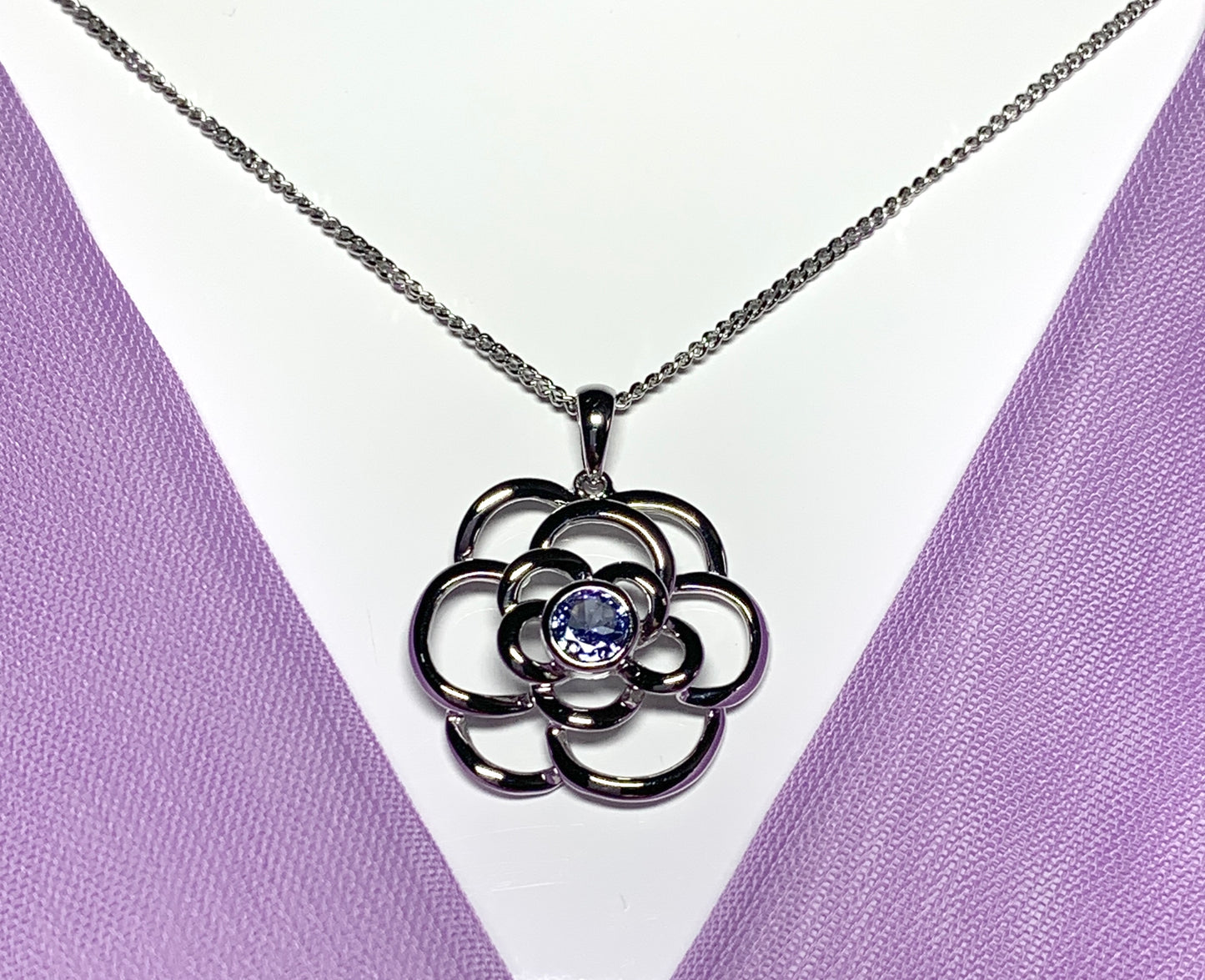 Real tanzanite round swirl necklace made in white gold