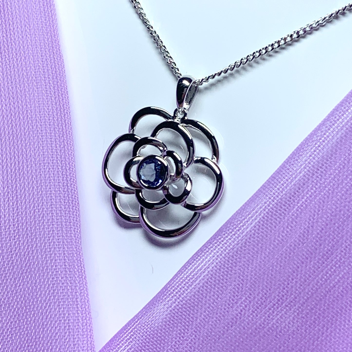 Real tanzanite round swirl necklace made in white gold