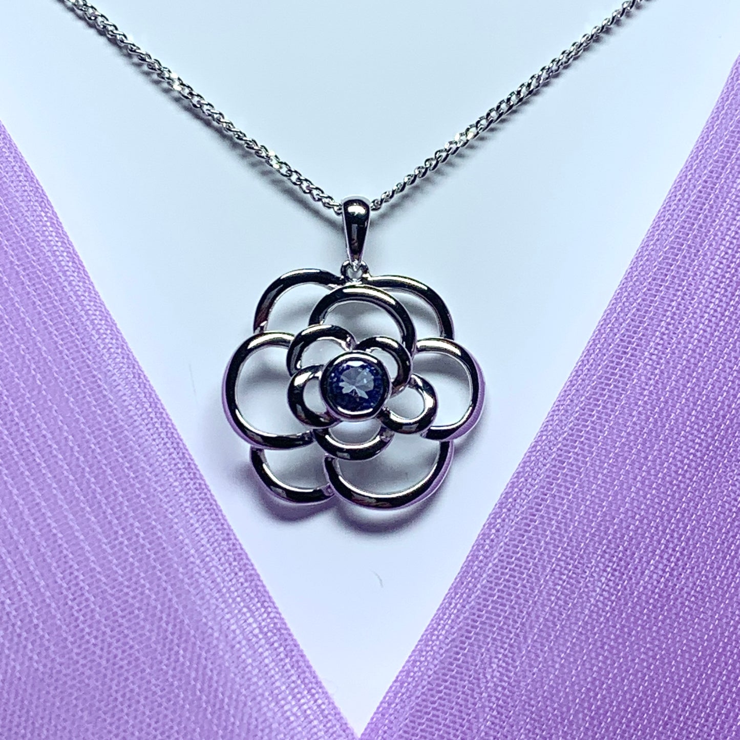 Real tanzanite round swirl necklace made in white gold