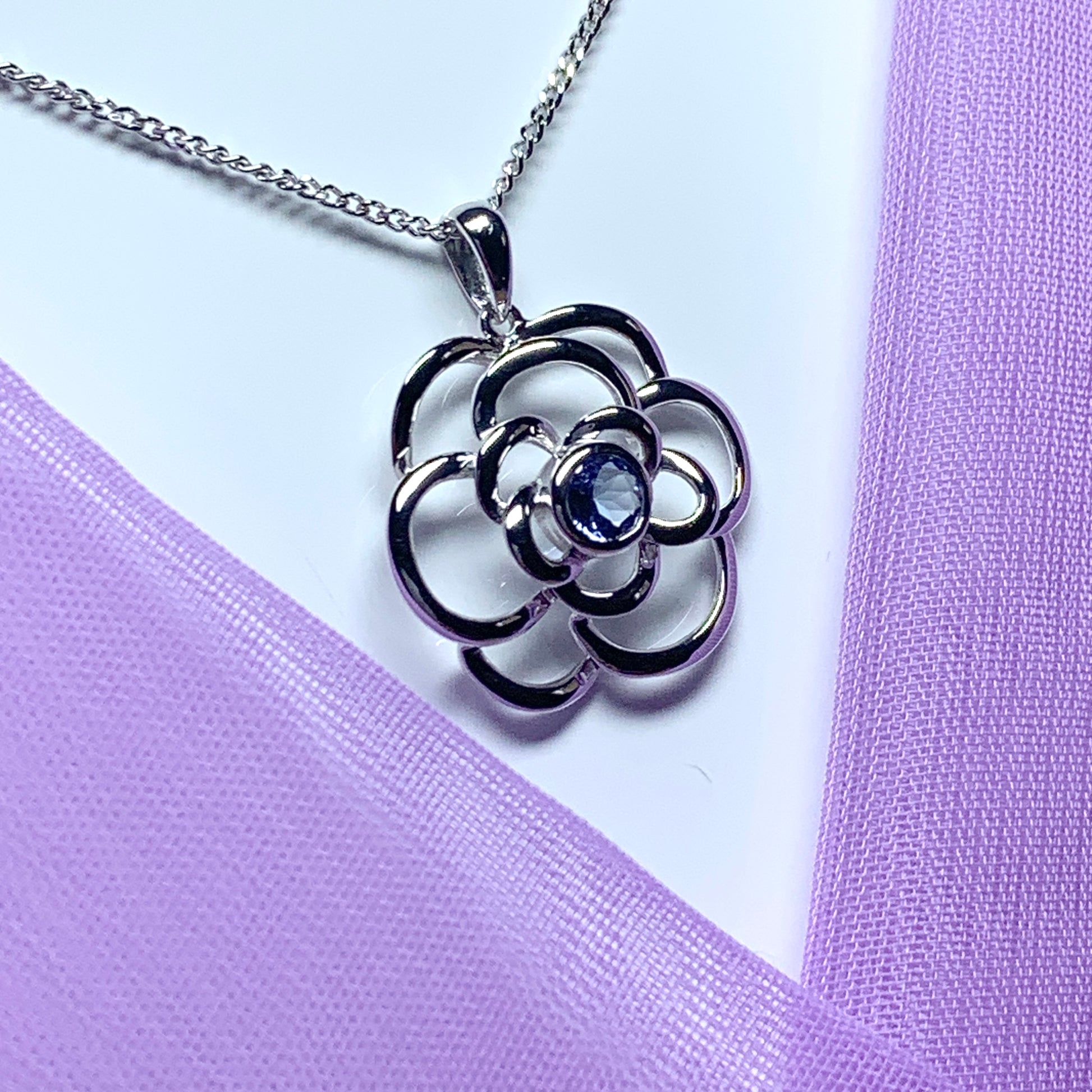 Real tanzanite round swirl necklace made in white gold