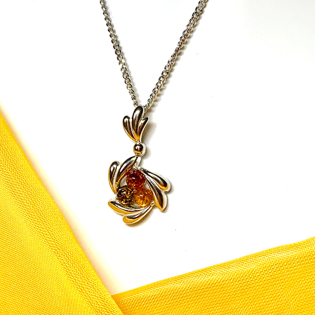 Swirl sterling silver multi coloured real amber necklace pendant