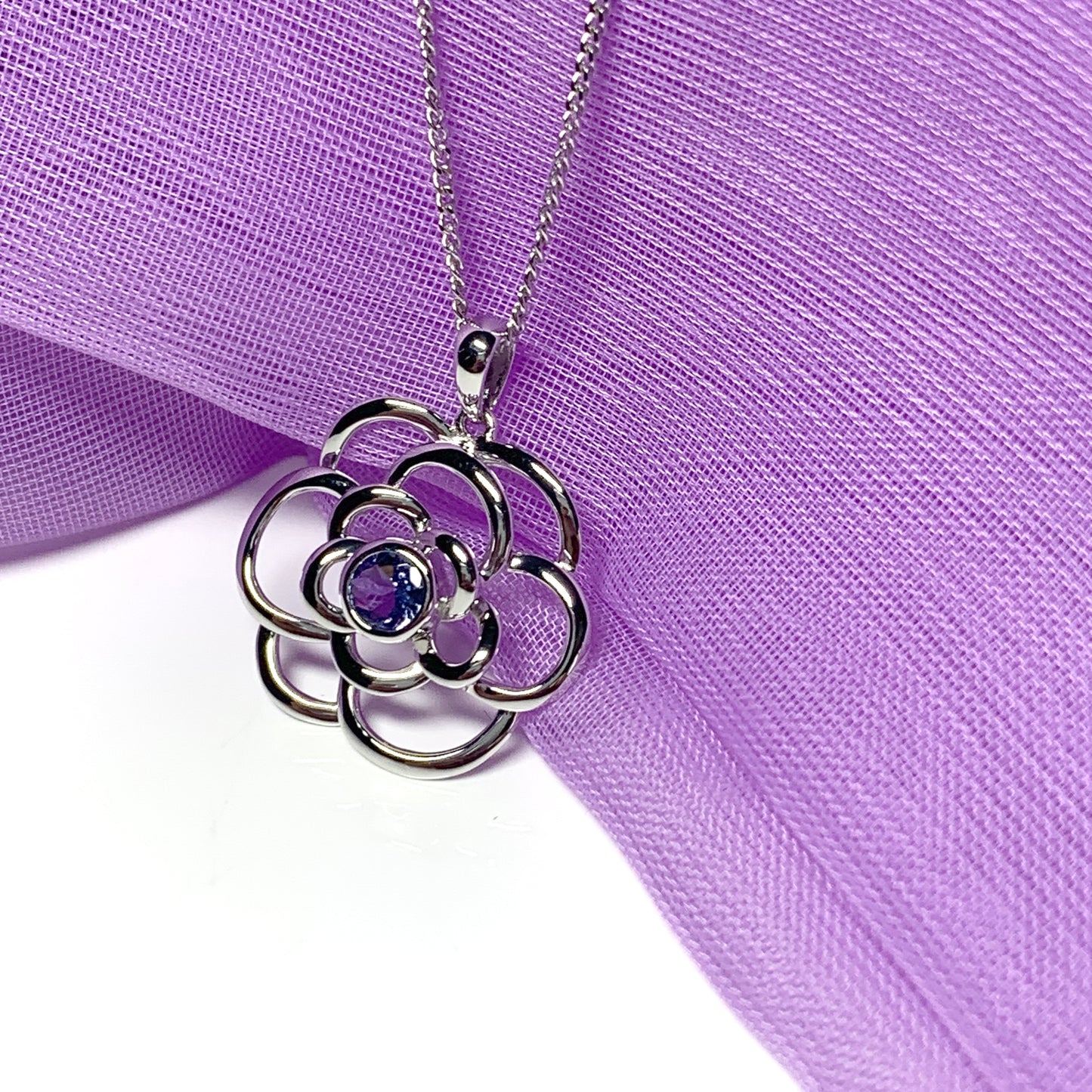 Real tanzanite round swirl necklace made in white gold