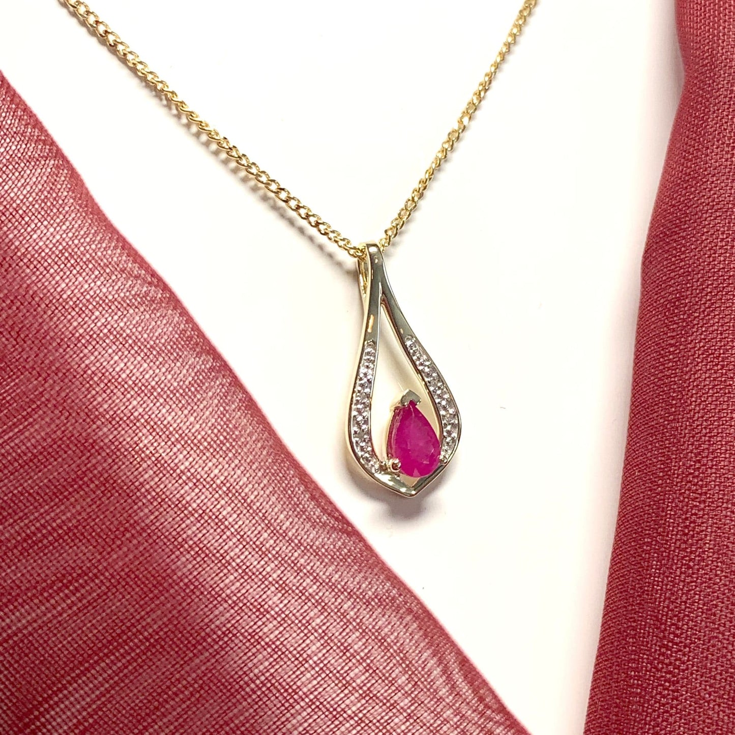 Teardrop red ruby and diamond necklace yellow gold