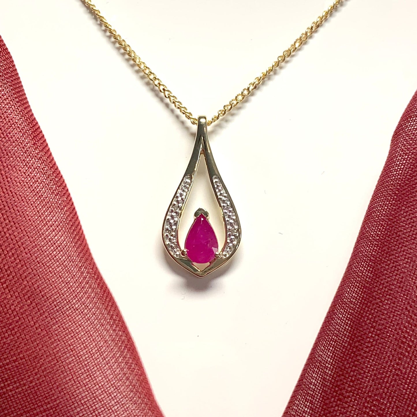 Teardrop red ruby and diamond necklace yellow gold