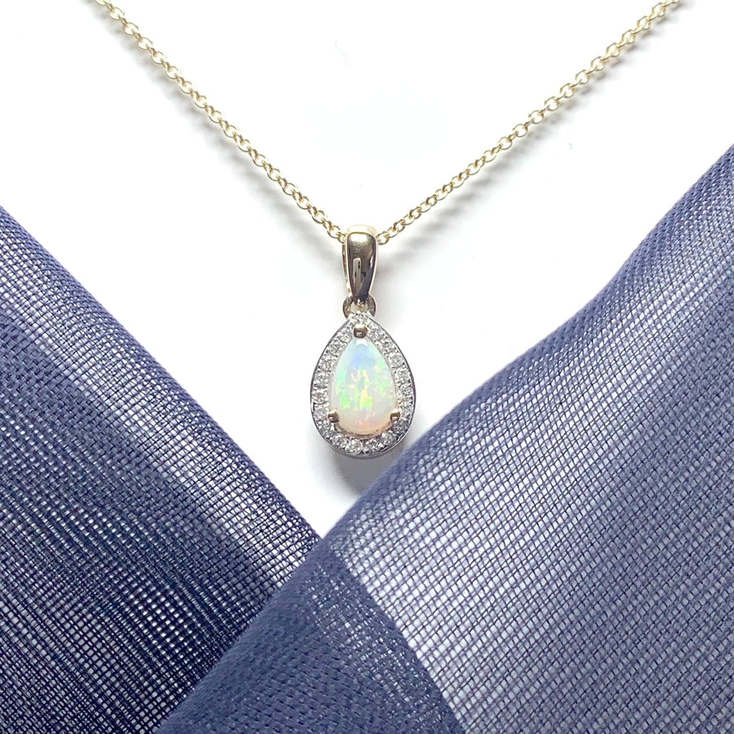 Teardrop shaped opal and diamond yellow gold cluster necklace