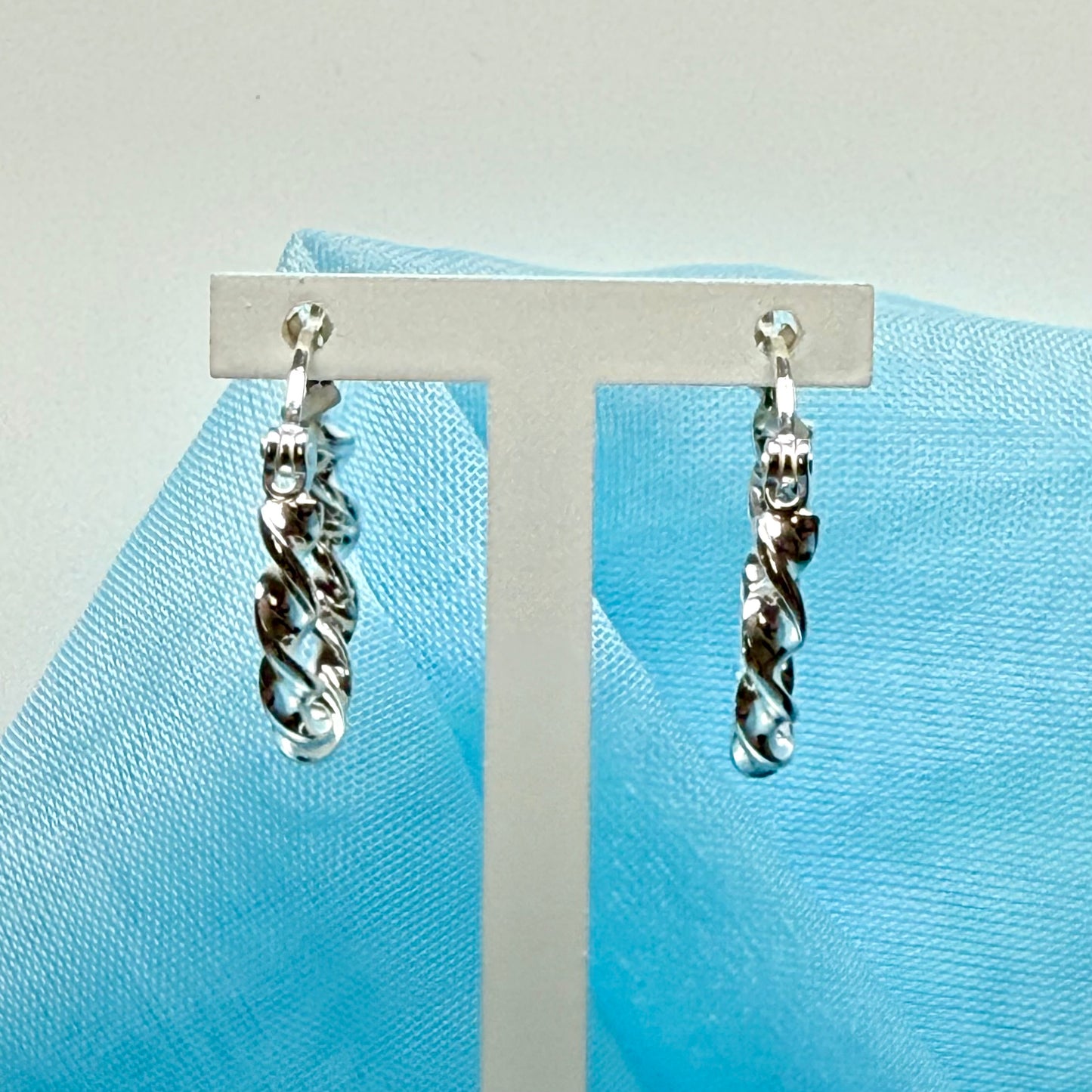 Twisted polished hoop earrings sterling silver round 17 mm