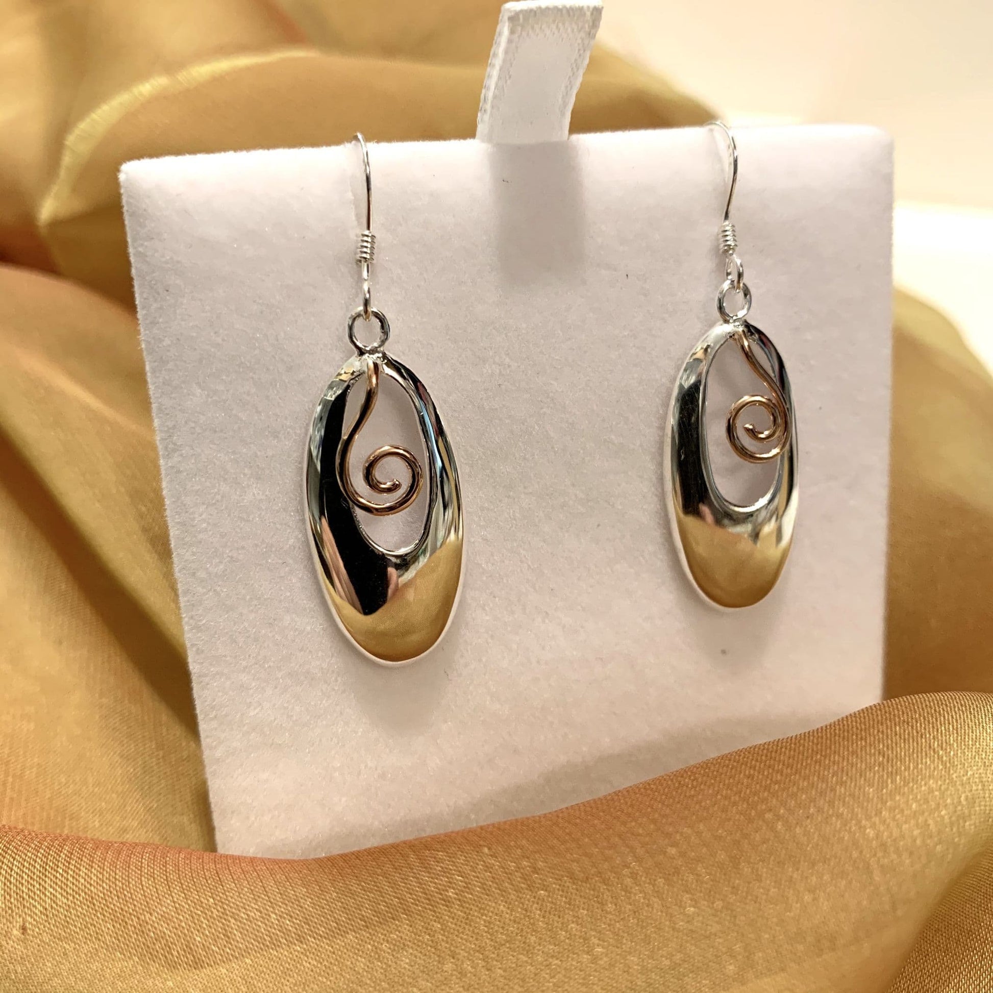 Two tone sterling silver and rose gilt oval drop earrings