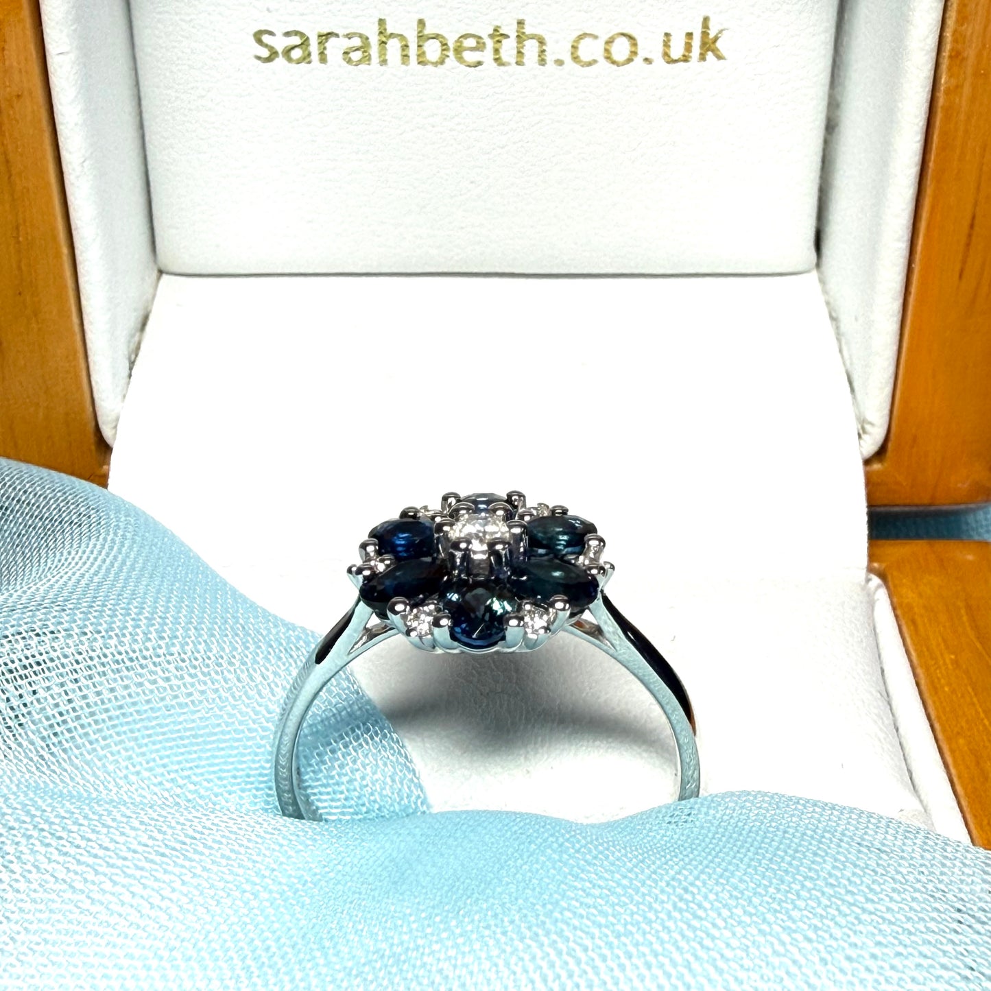 White gold real dark blue sparkling sapphire and diamond round shaped cluster ring