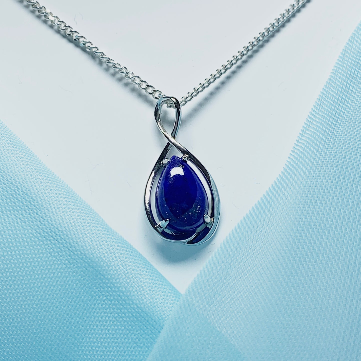 White gold pear teardrop shaped blue lapis lazuli necklace pendant