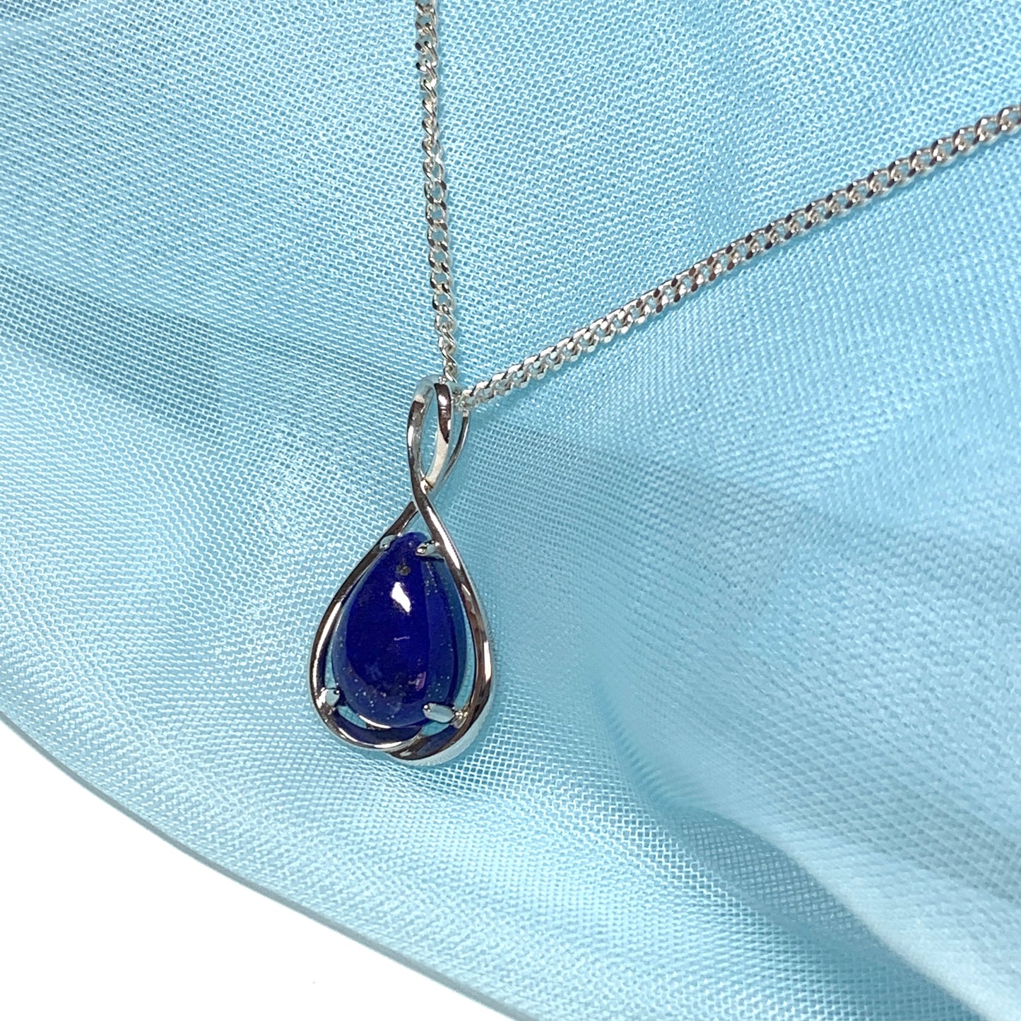 White gold pear teardrop shaped blue lapis lazuli necklace pendant