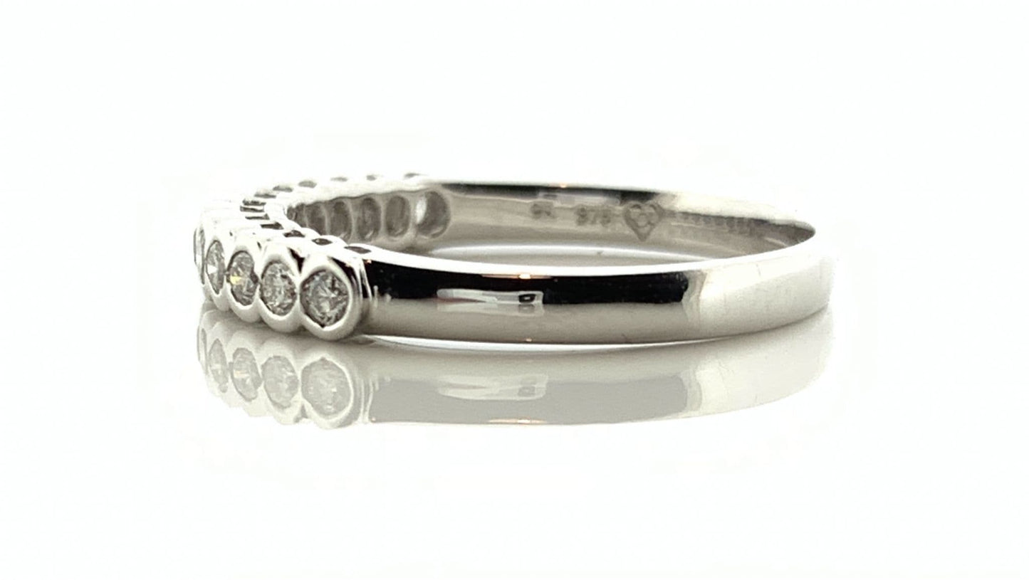 White gold round cut eternity ring diamond rubbed over setting