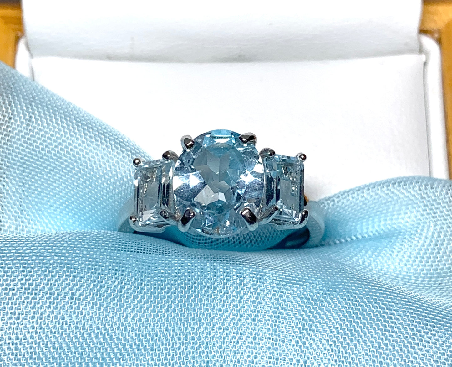 Blue topaz trilogy three stone dress ring white gold