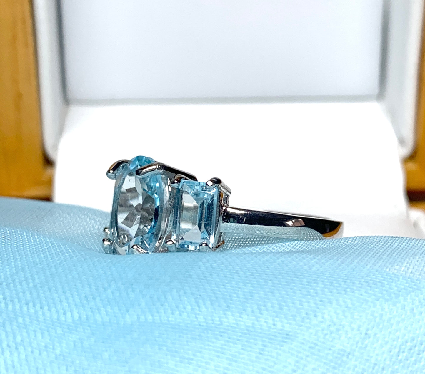 Blue topaz trilogy three stone dress ring white gold